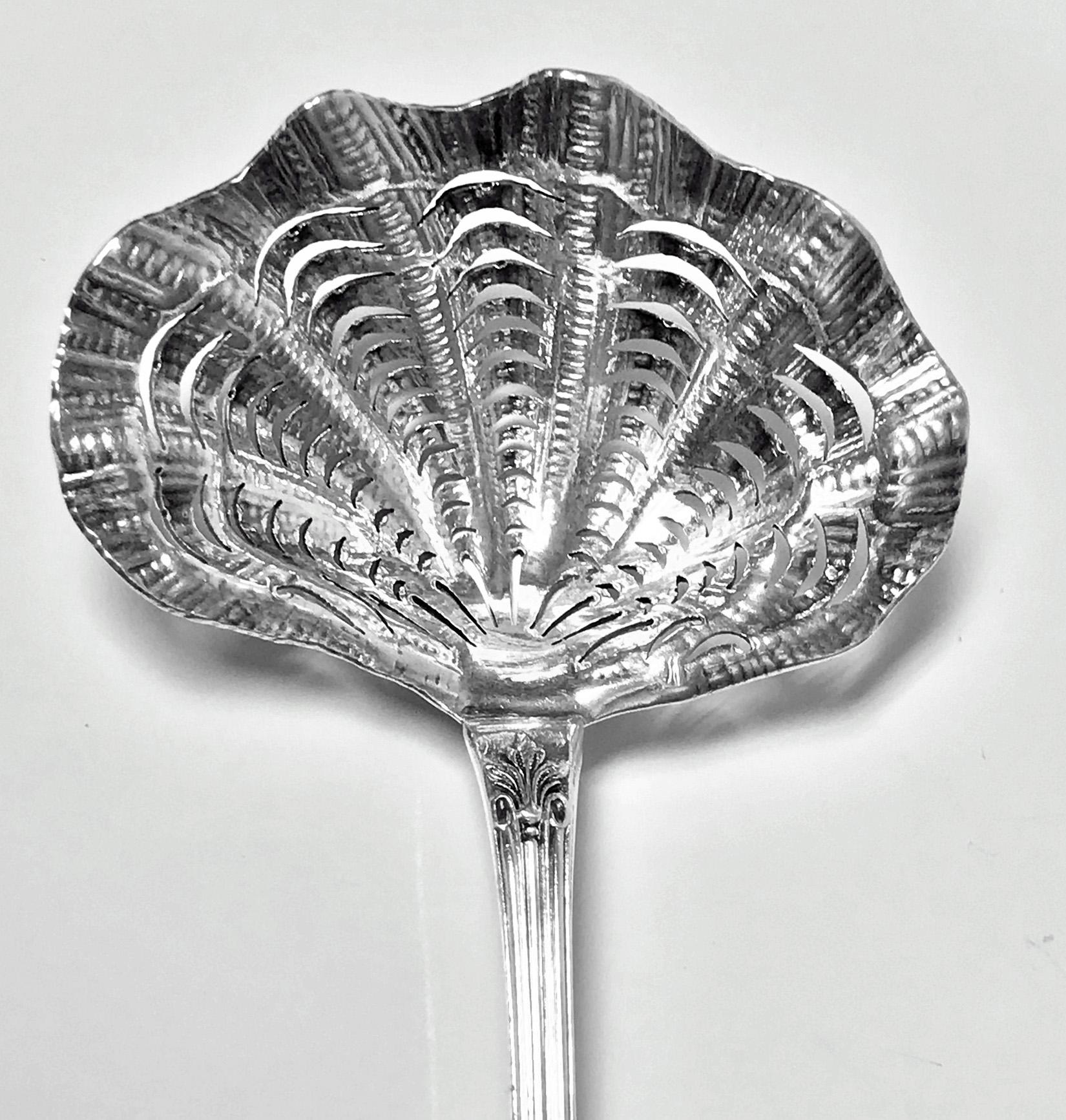 French Silver Sifter ladle, probably Pierre Queille 1834-1846. French Silver Minerva 1st standard (950 std) mark and what appears to be PQ between a spade in lozenge. Wonderful scale pierced textured scalloped shell bowl, tapered thread and rosette