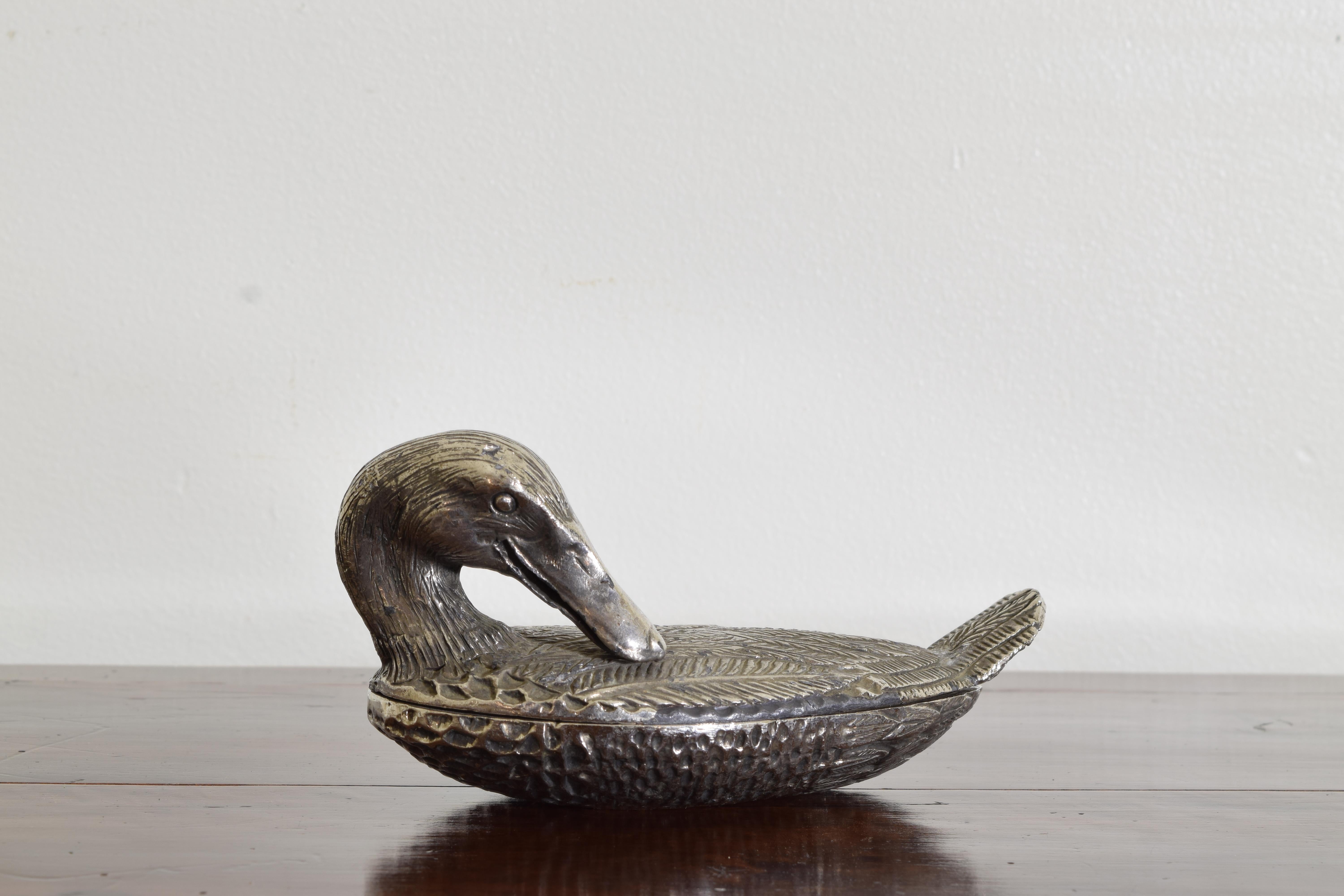 The duck finely cast in repose, in an upper and lower sections
