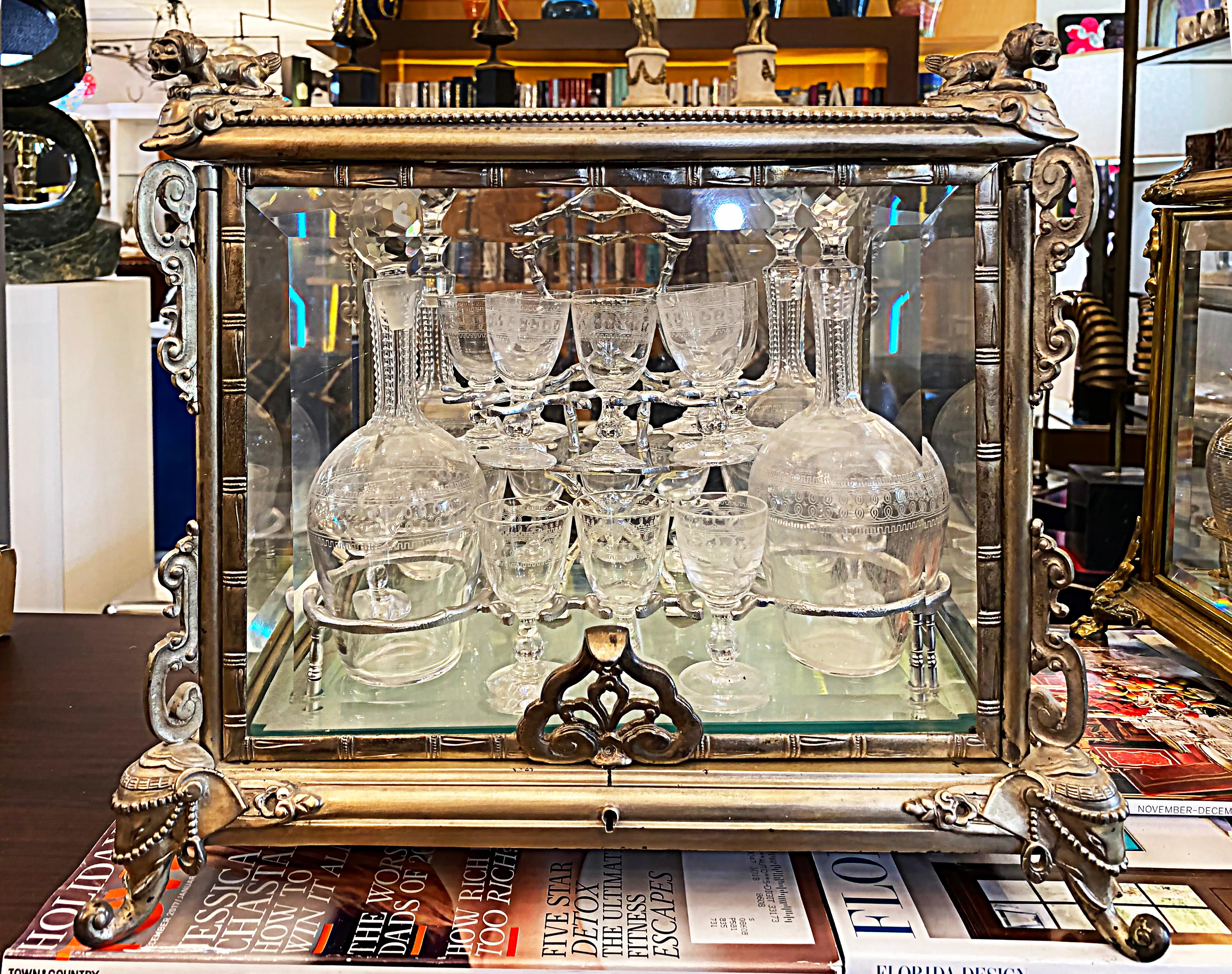 French Silvered Bronze cut crystal tantalus set, decanters and glassware 

Offered for sale is a 19th-century French bronze tantalus set with cut crystal decanters and glassware. The set is in very good vintage condition however, the case does