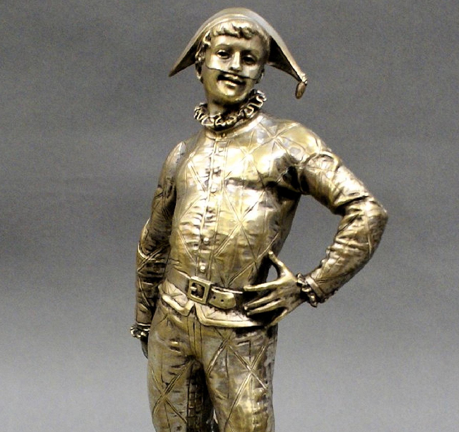 This charming and very handsome French silvered bronze depicts a young harlequin on his original red marble base, signed by Emile Laporte, a well-known artist of the time. 
Emile Laporte (1858-1907) was born in Paris on November 18, 1858. He
