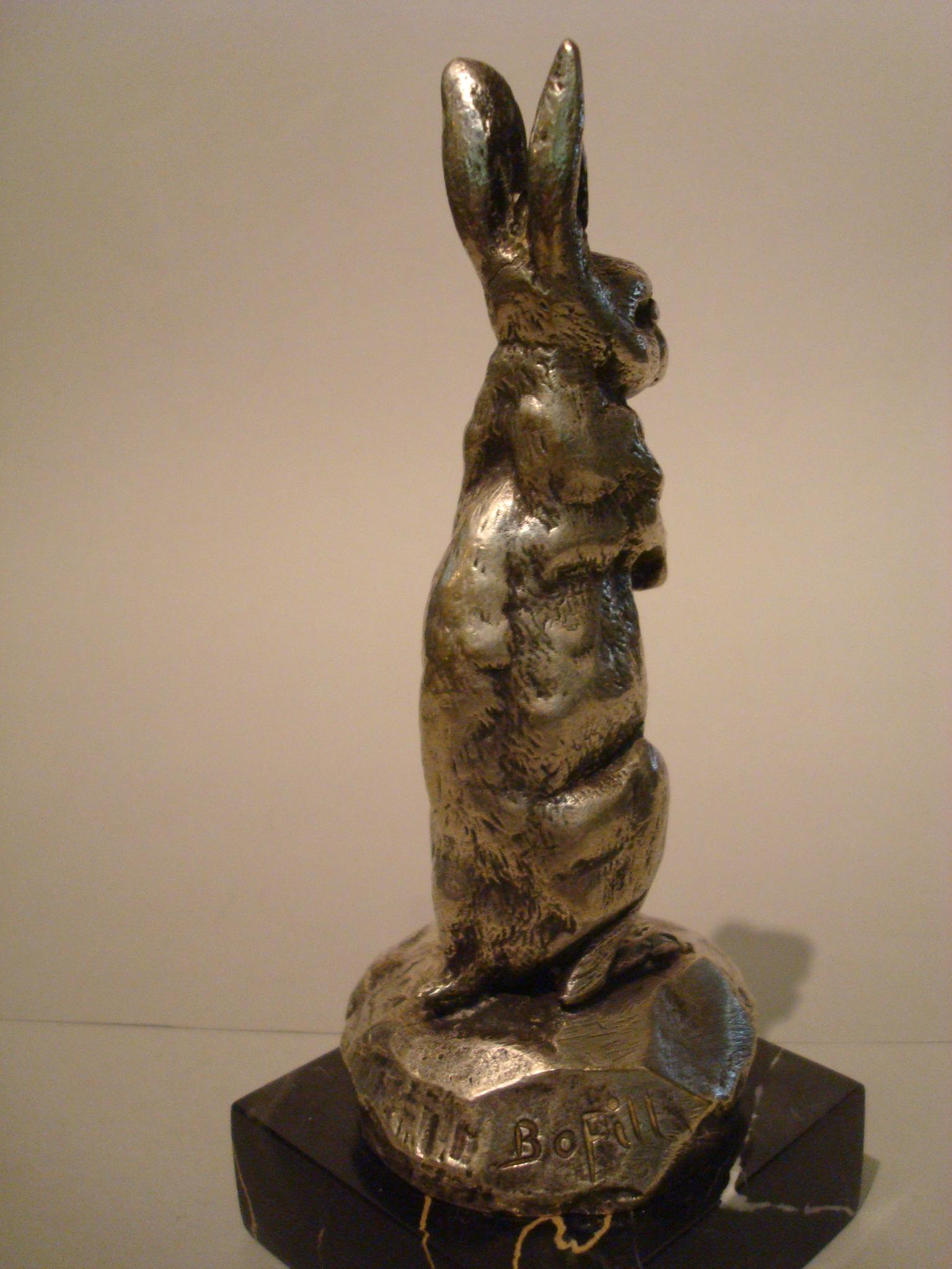 French silvered bronze rabbit car mascot hood ornament desk paperweight Signed Bofill, circa 1910-15. Rabbit Mascotte Automobil signed Bofill and marked with foundry mark.
Nice pieace of Automobilia. Mounted over a Black and gold Italian Portoro