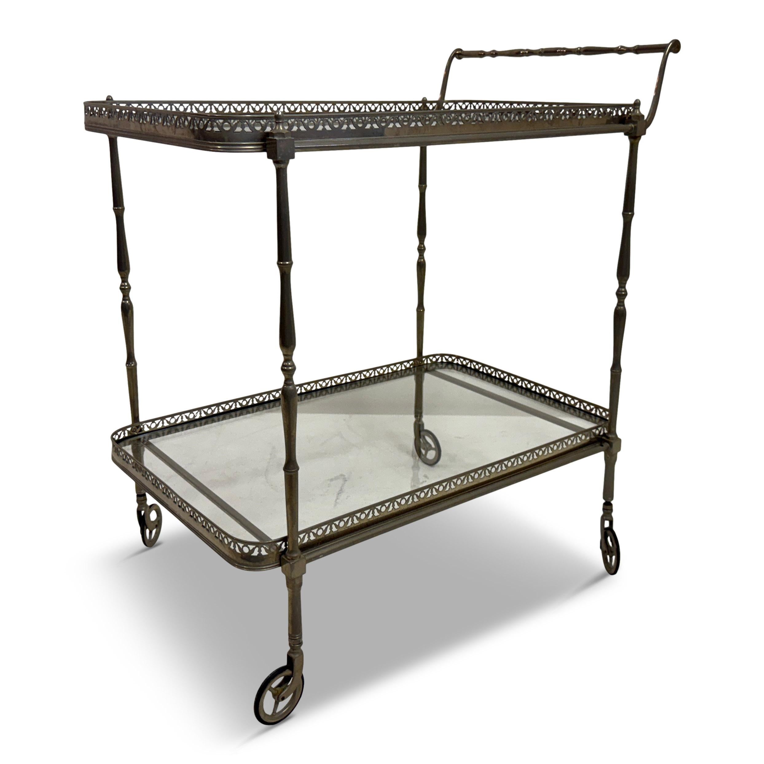 French Silvered Drinks Trolley, 1960s


A finely made French drinks trolley from the 1960s, constructed in silvered metal with a graceful, time-softened patina. The frame rests on small spoked wheels and is detailed with slender turned supports,