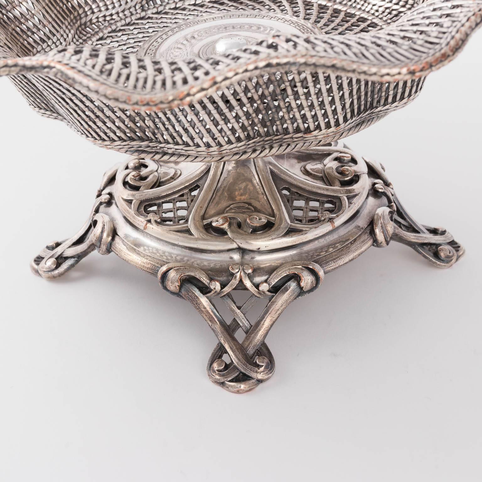 Woven silvered basket by Christolfe, circa 20th century. Originally retailed at Berdorf Goodman for $1195 in their vintage home collection.
 