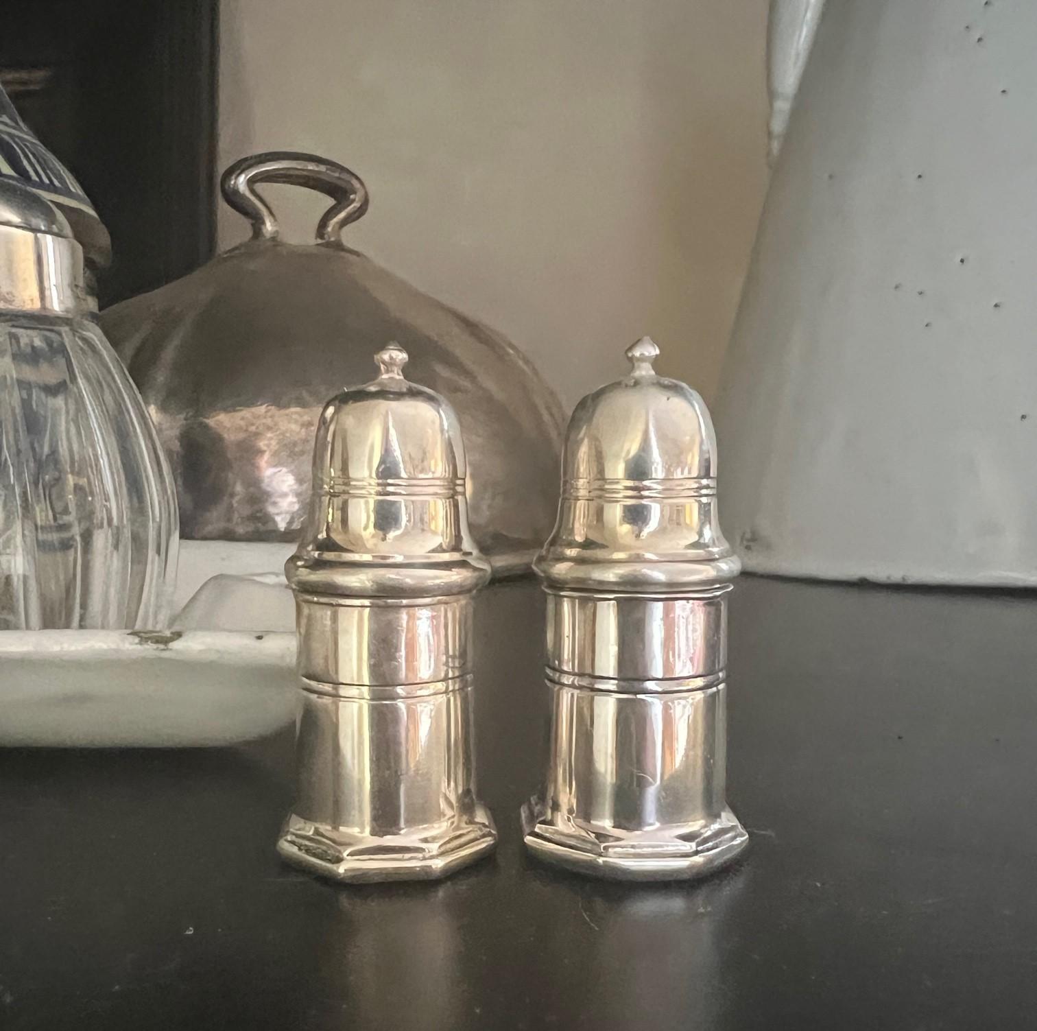 Small vintage silver plated salt and pepper set made in France by Christofle. Each shaker has a locking system built in and each include the impressed Christofle marks. The set includes the original box.