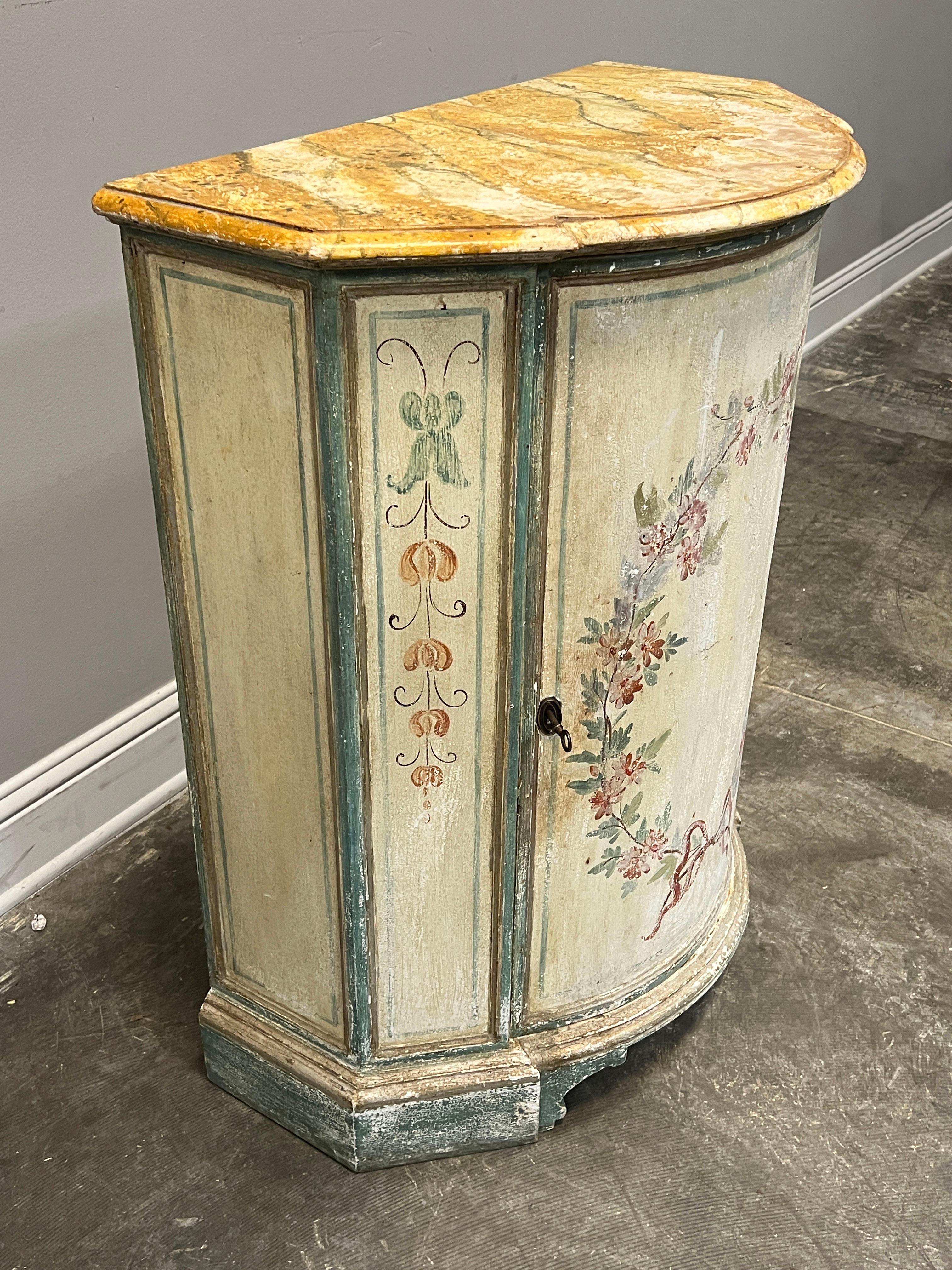 20th C. French single door hand painted cupboard with painted faux bois top. Paint design indicative of the Louis XVI style. Great cabinet for a potential sink in a powder bath with a single shelf and working key.