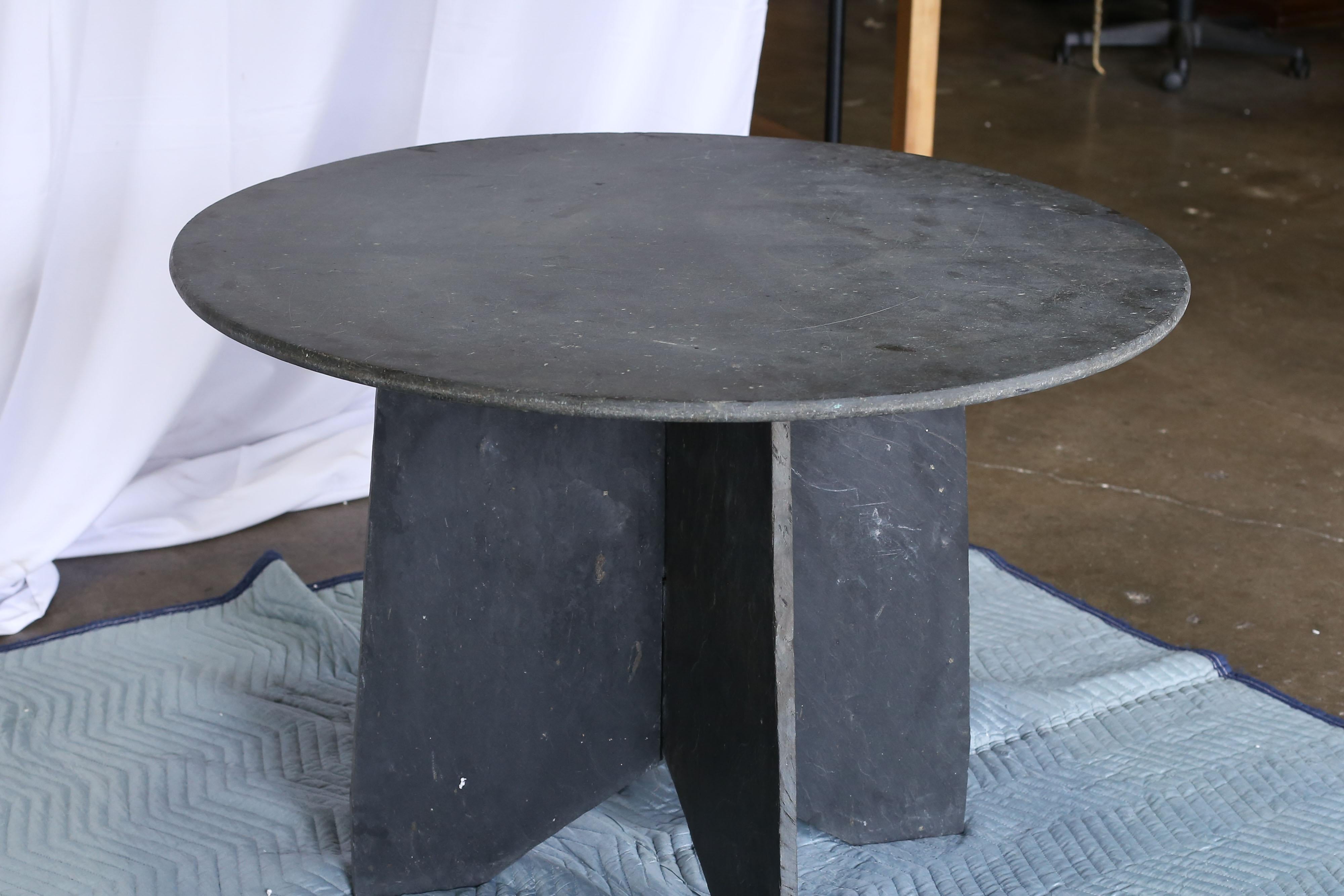 Round slate table from Ardoise, France. Bottom consists of two interlocking pieces with a single round top. All natural stone.