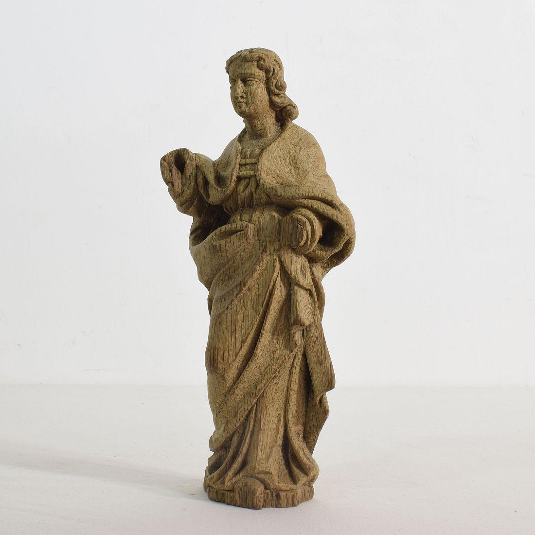 Beautiful weathered small oak saint statue,
France, 18th century. Weathered and small losses.



  