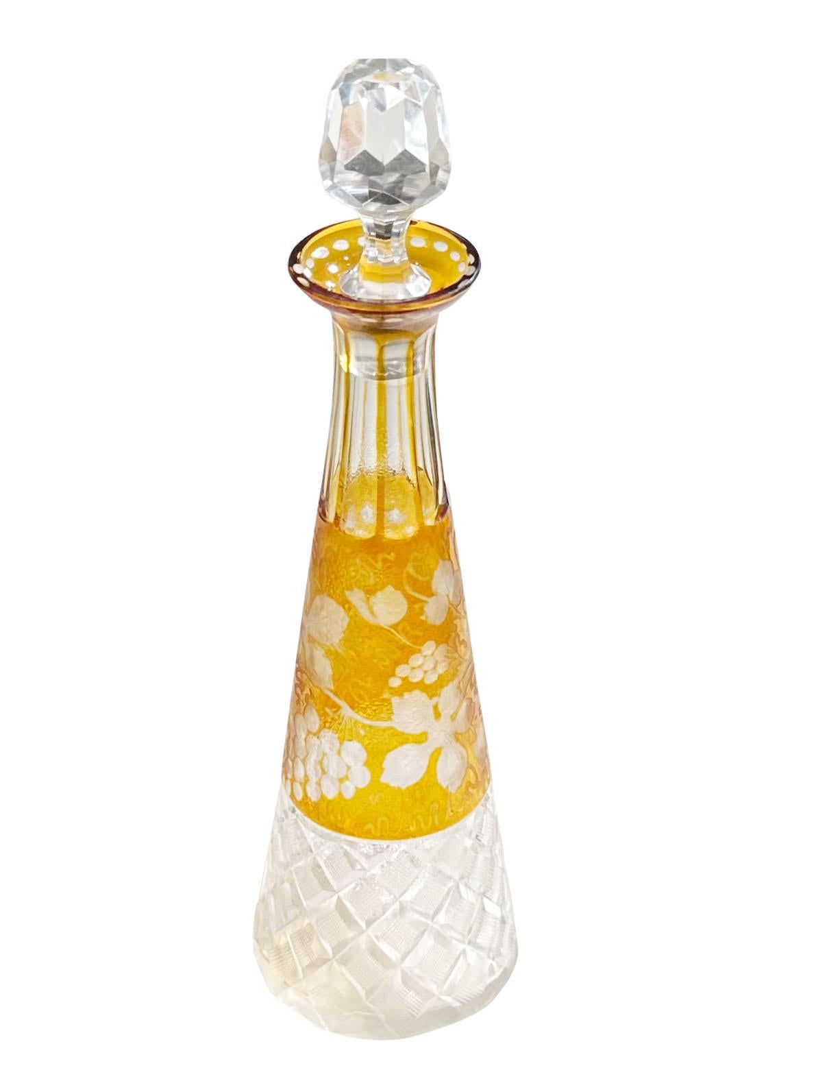 A beautiful French small decanter with original stopper. The yellow is etched in vines with grapes that is cut to clear. The stopper is three inches long. 19th century, France.