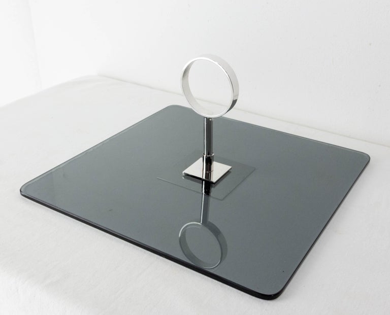 Midcentury cheese board 
French
Smoked glass and chrome
In good condition 

Shipping:
L 29 P29 H2,5 1,4 kg.