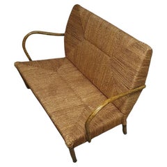 French sofa /  A metal frame base, bentwood armrests and a papercord seating