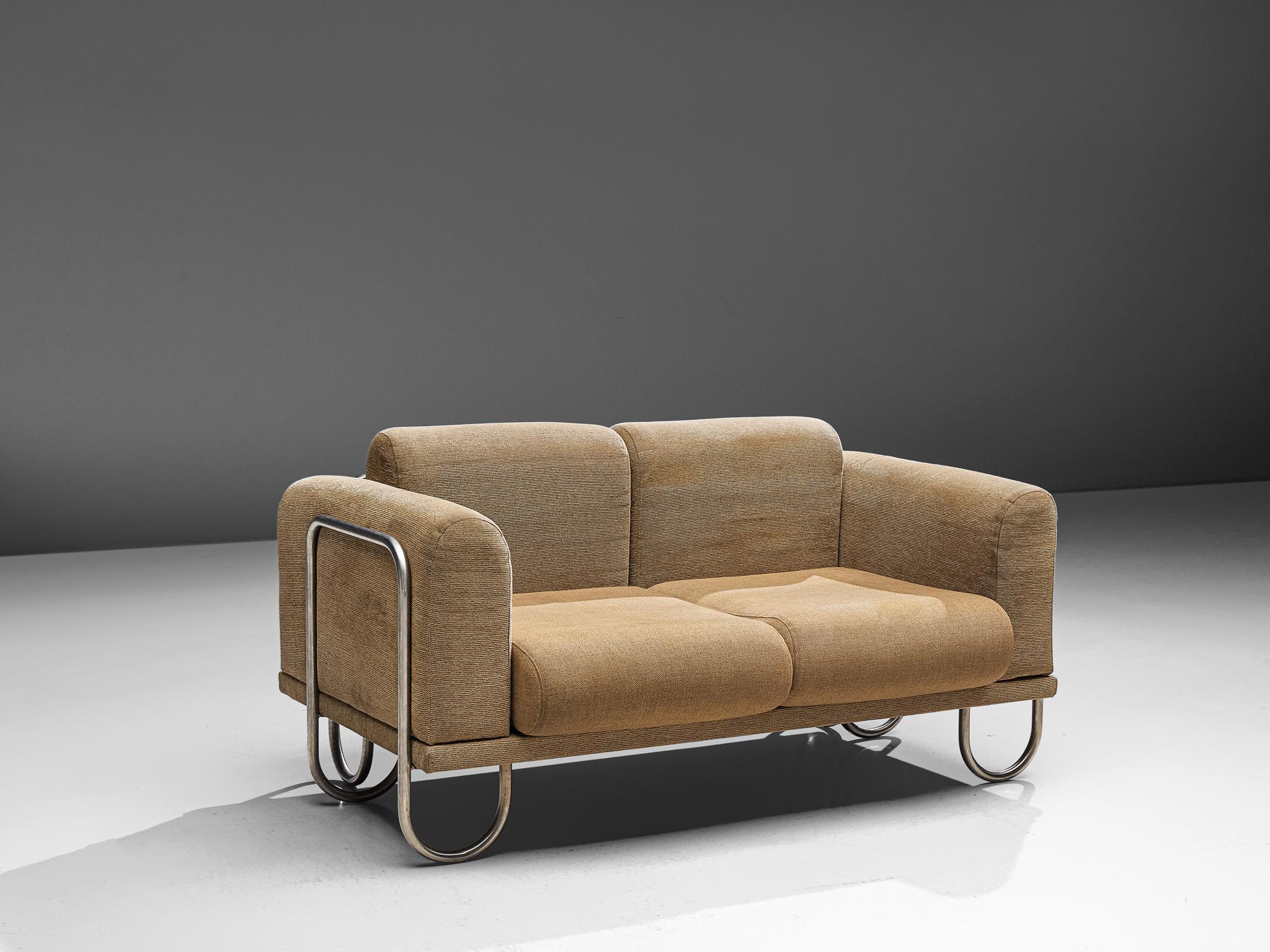 Sofa, fabric and metal, France, 1970s.

A comfortable sofa that features a curved, chromed tubular frame. The frame appears to be an on-going curved line, moving upwards to support the cushions and downwards, functioning as legs. The seat is shaped
