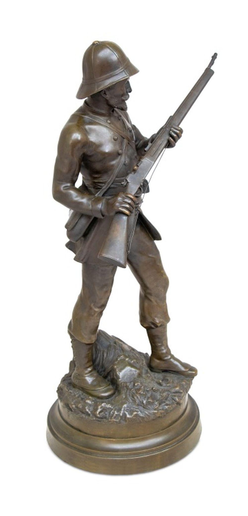 French Soldier Patinated Bronze Sculpture, late 19th century, the figure depicted in tropical uniform, carrying a rifle at port arms, signed to base 