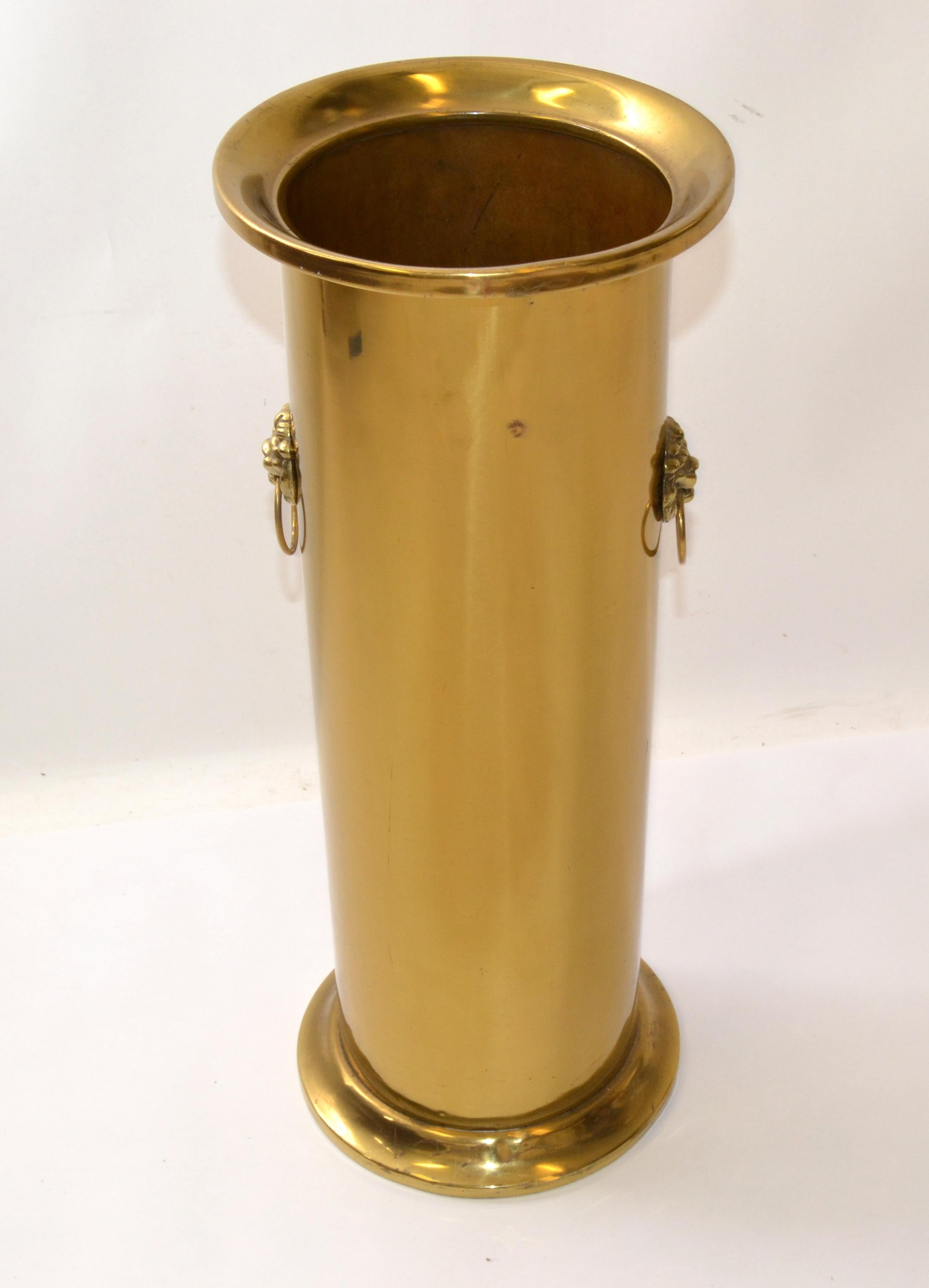 Mid-20th Century French Louis XVI solid brass umbrella stand. Brass Canister with black inside and topped off with a brass crown.
In fair well used condition with warm aged Patina to the Brass.