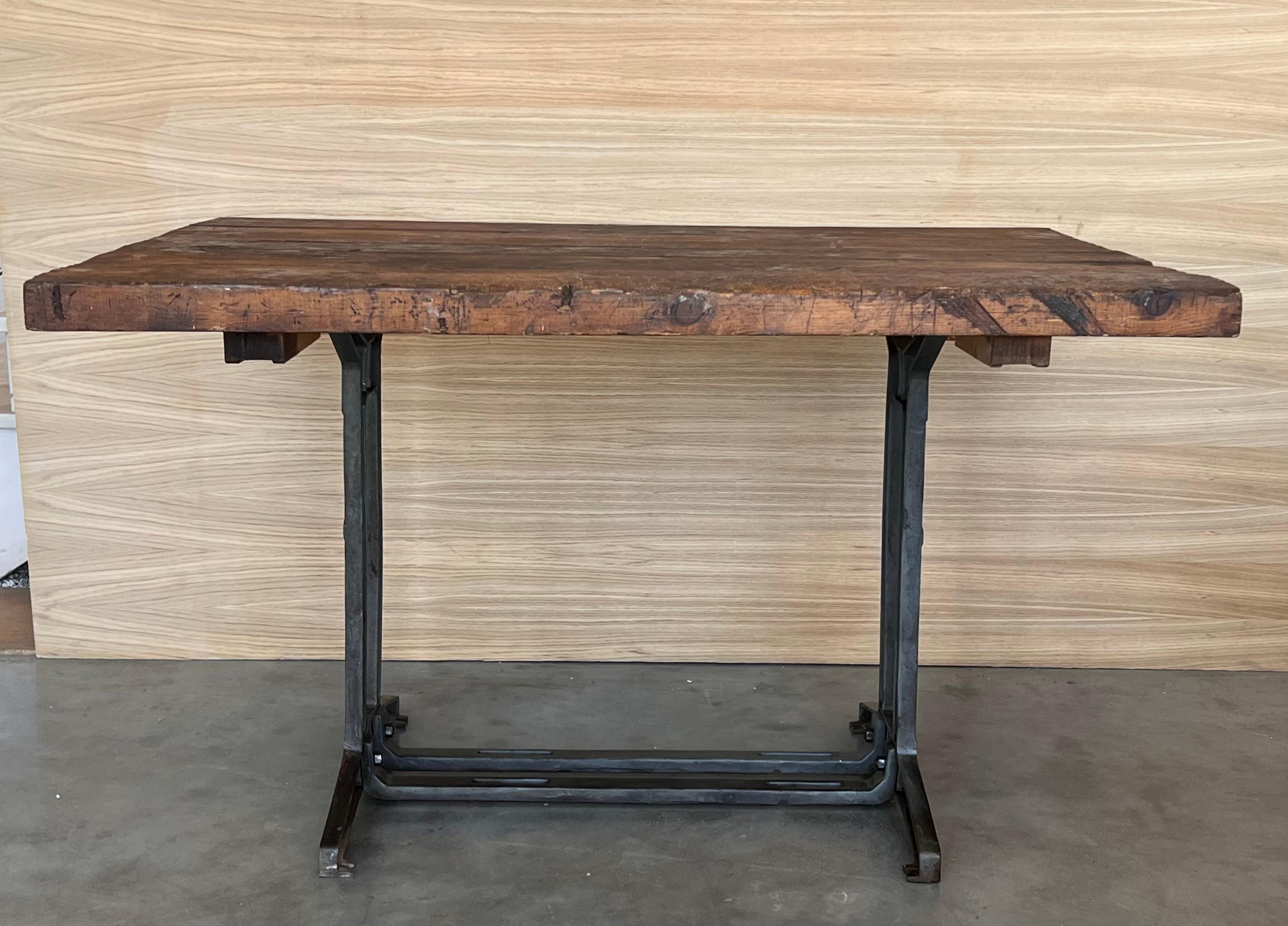 Work table with walnut top. Item features impressive cast iron construction, two pedestal legs, fancy scroll work to legs and feet, weighs approximately 80 lbs. Circa early to mid-19th century.


Board thickness: 2.16in