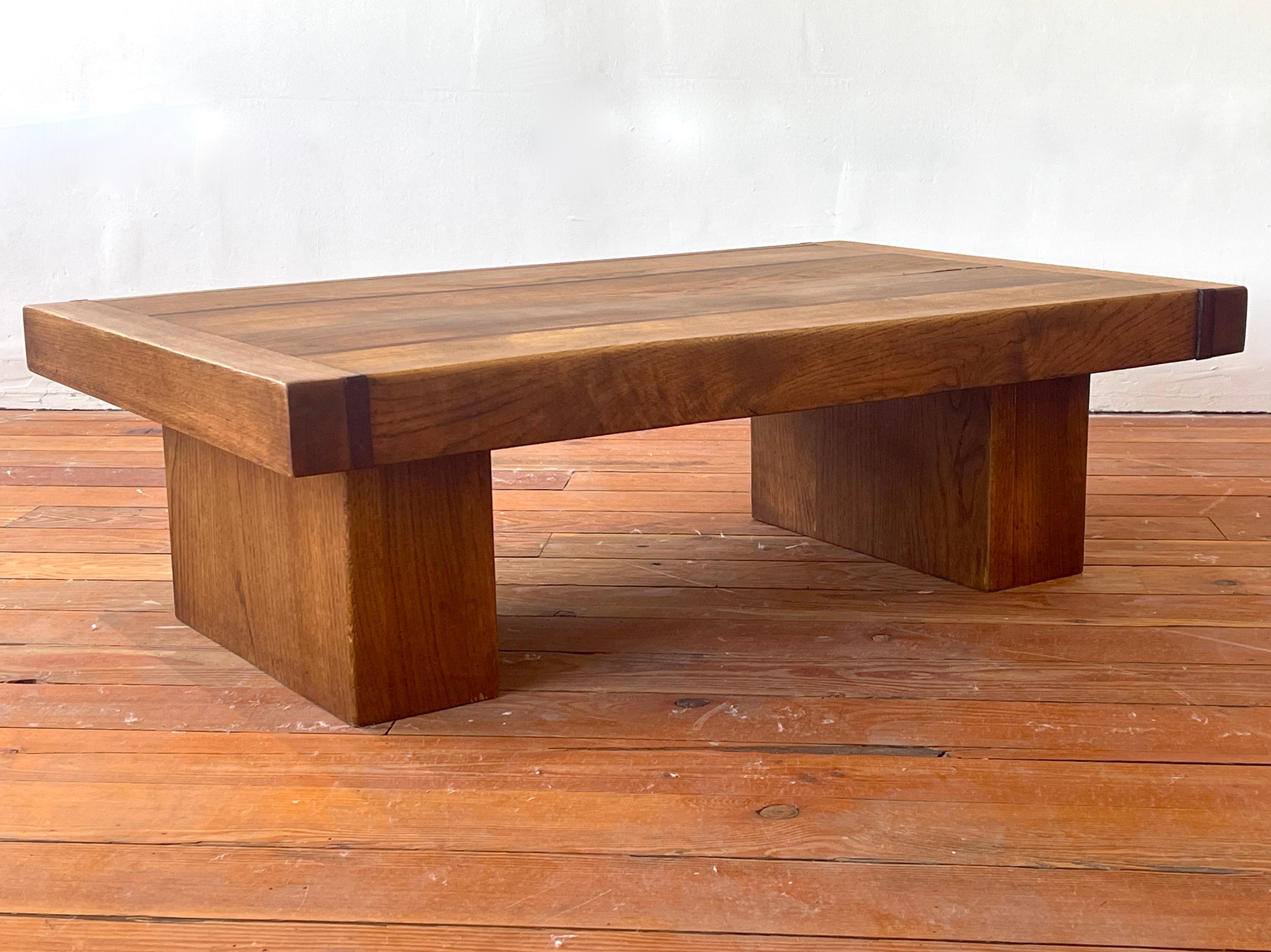 Solid oak coffee table with gorgeous wood grain, France circa 1950's. 
In the style of Pierre Chapo - incredible construction and 3