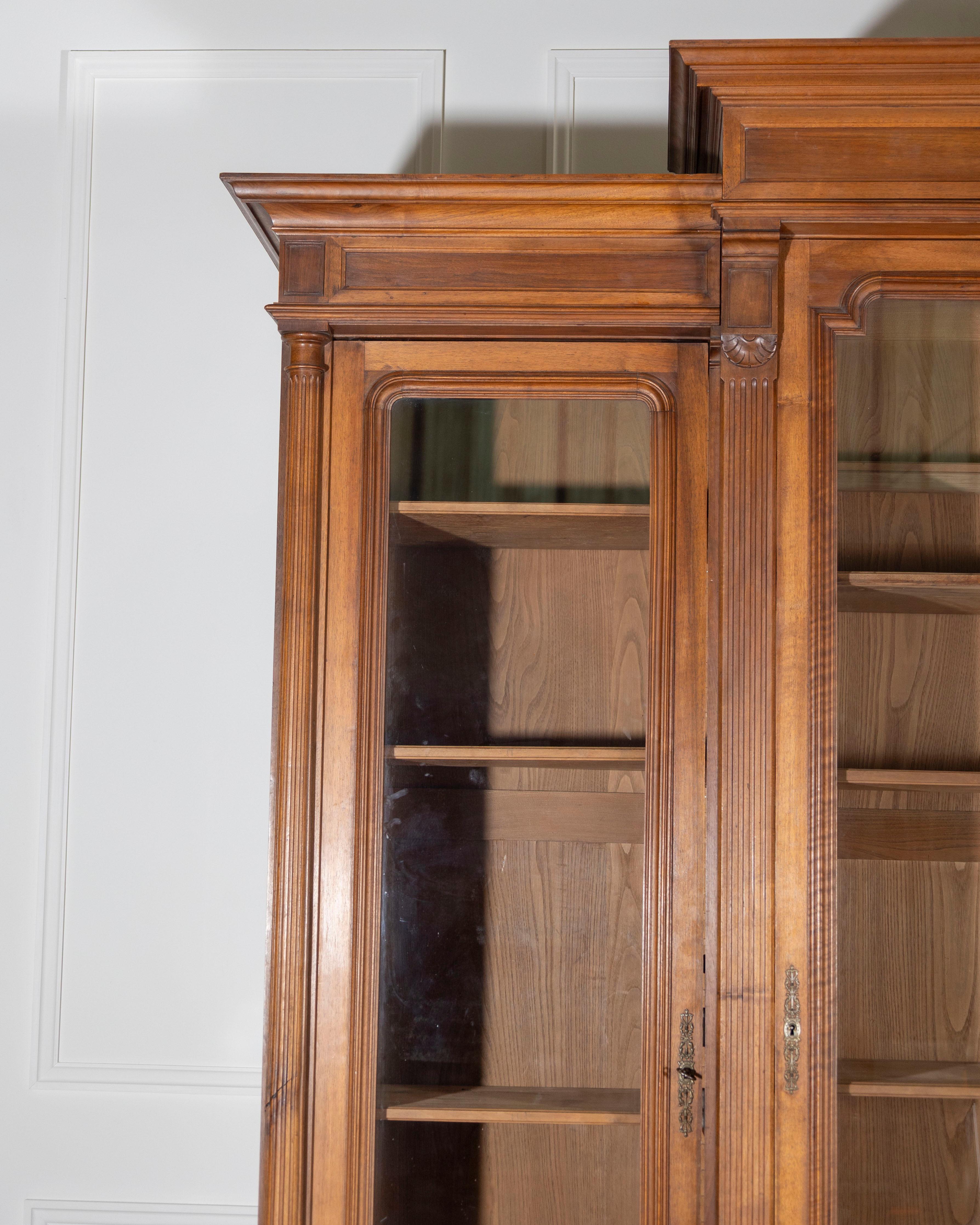 Polished French Solid Walnut Bookcase with Carved Columns, Late 19th Century For Sale