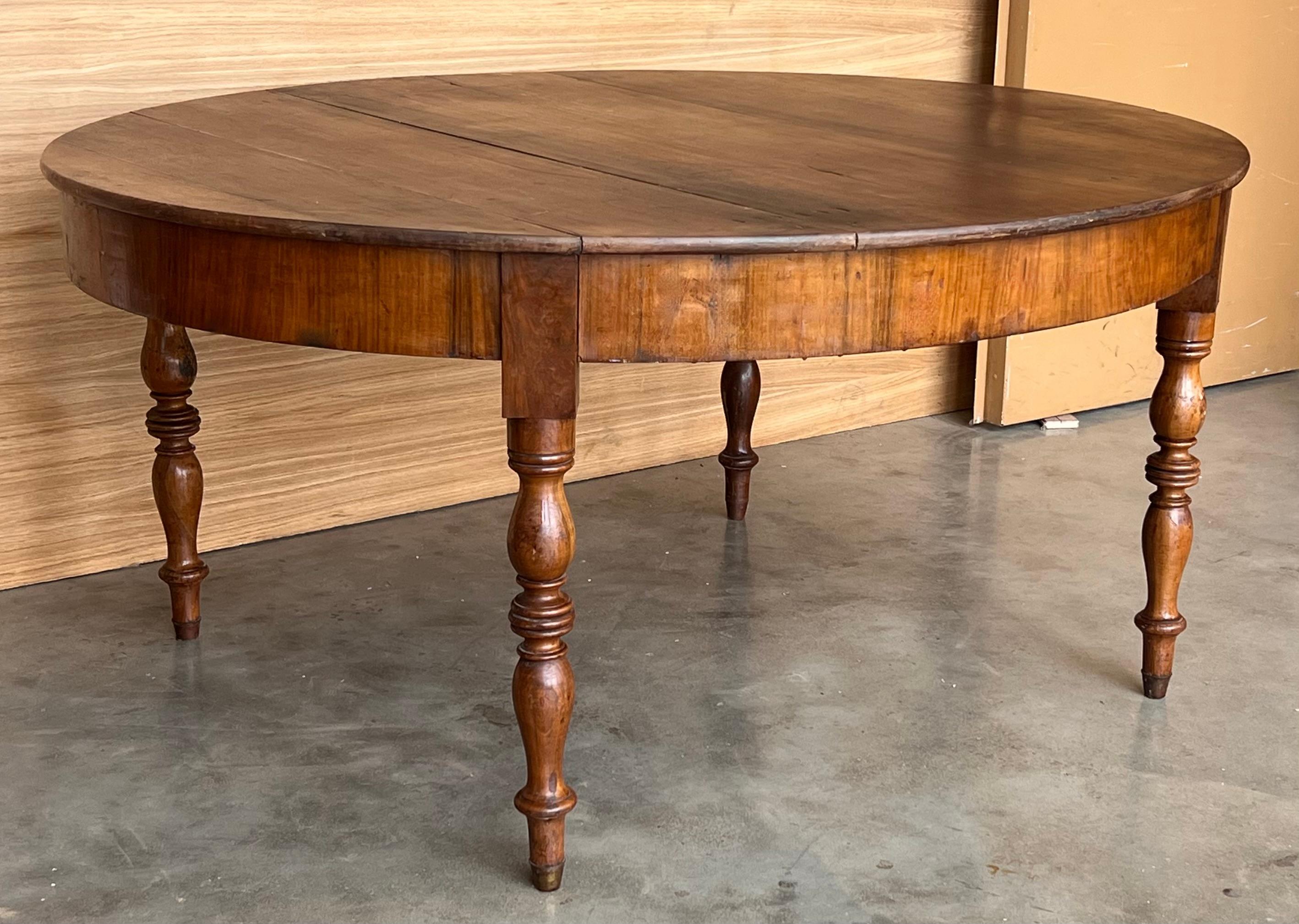 French Provincial French Solid Walnut Oval Center Table with Four Turned Legs For Sale