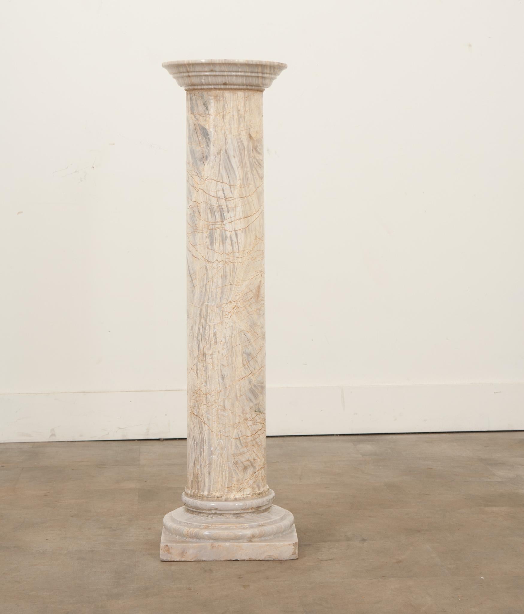A solid marble column made in the early 1900’s France, with a beautiful naturally aged patina. This carved column would be perfectly topped with an urn, vase, or sculpture in any covered outdoor setting or inside your home.  Be sure to view the