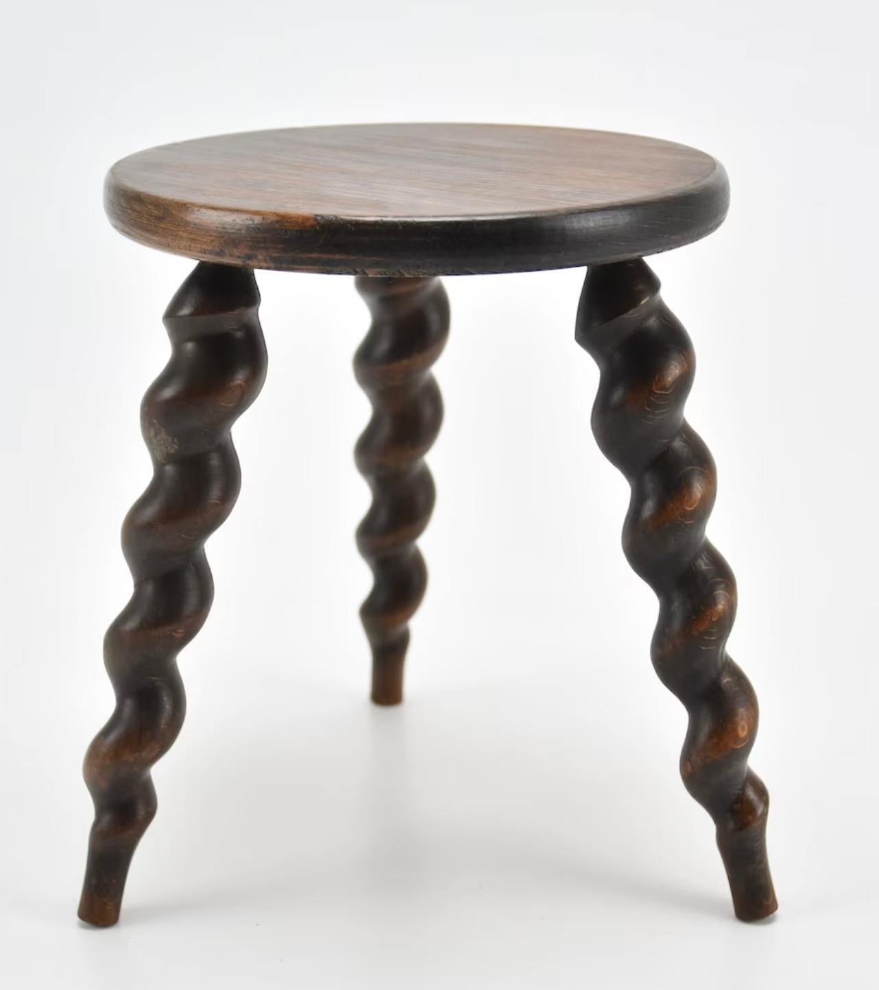 Beautiful wooden stool made in France, circa 1950s. Amazing craftsmanship on spiral legs. Great patina and grain. See photos for condition and coloring.
 