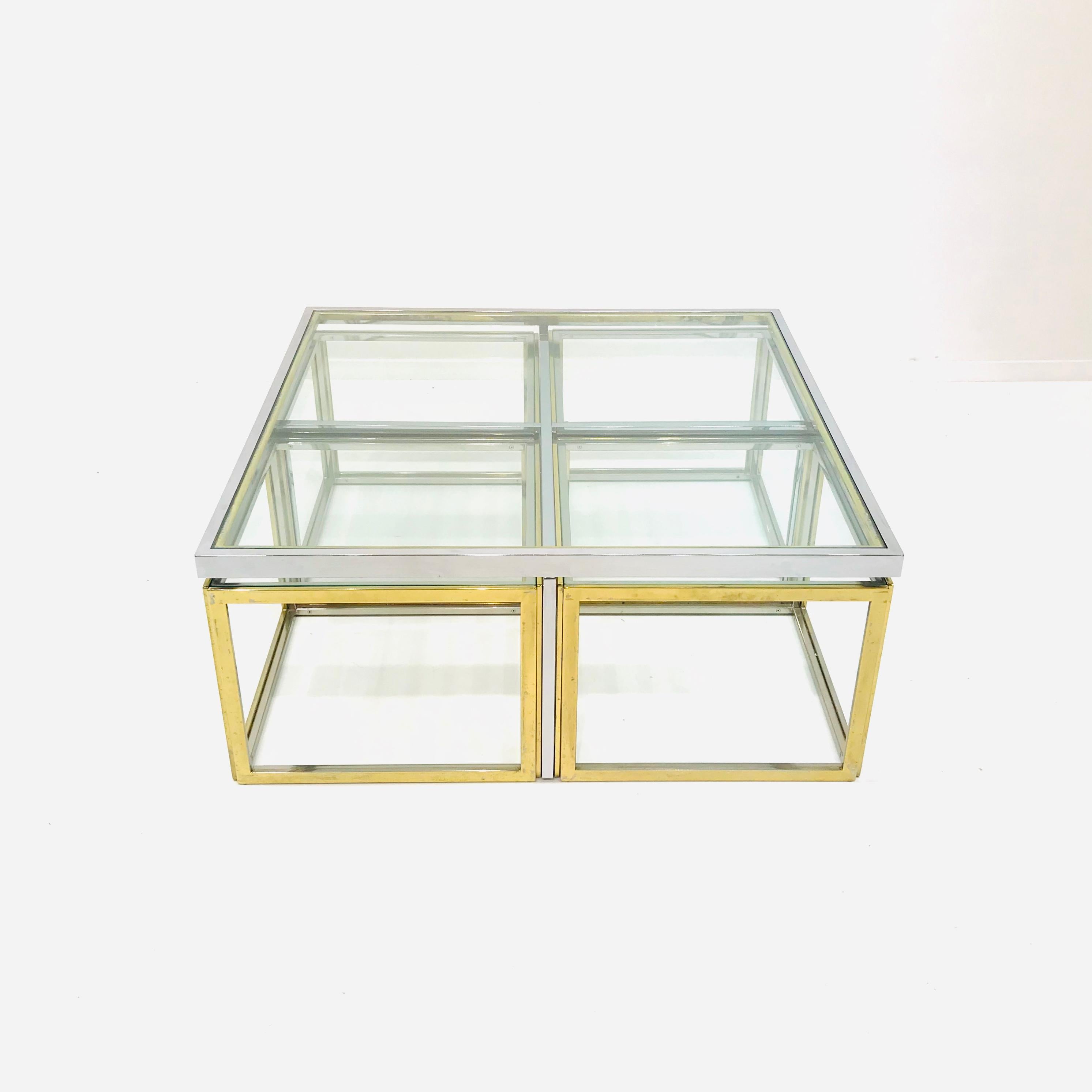 This rare coffee table was designed by Jean Charles in the seventies. The square elegant coffee table was a design for “Maison Charles” in France. This long established Design House was founded in 1908 in Paris. The large square table embraces 4