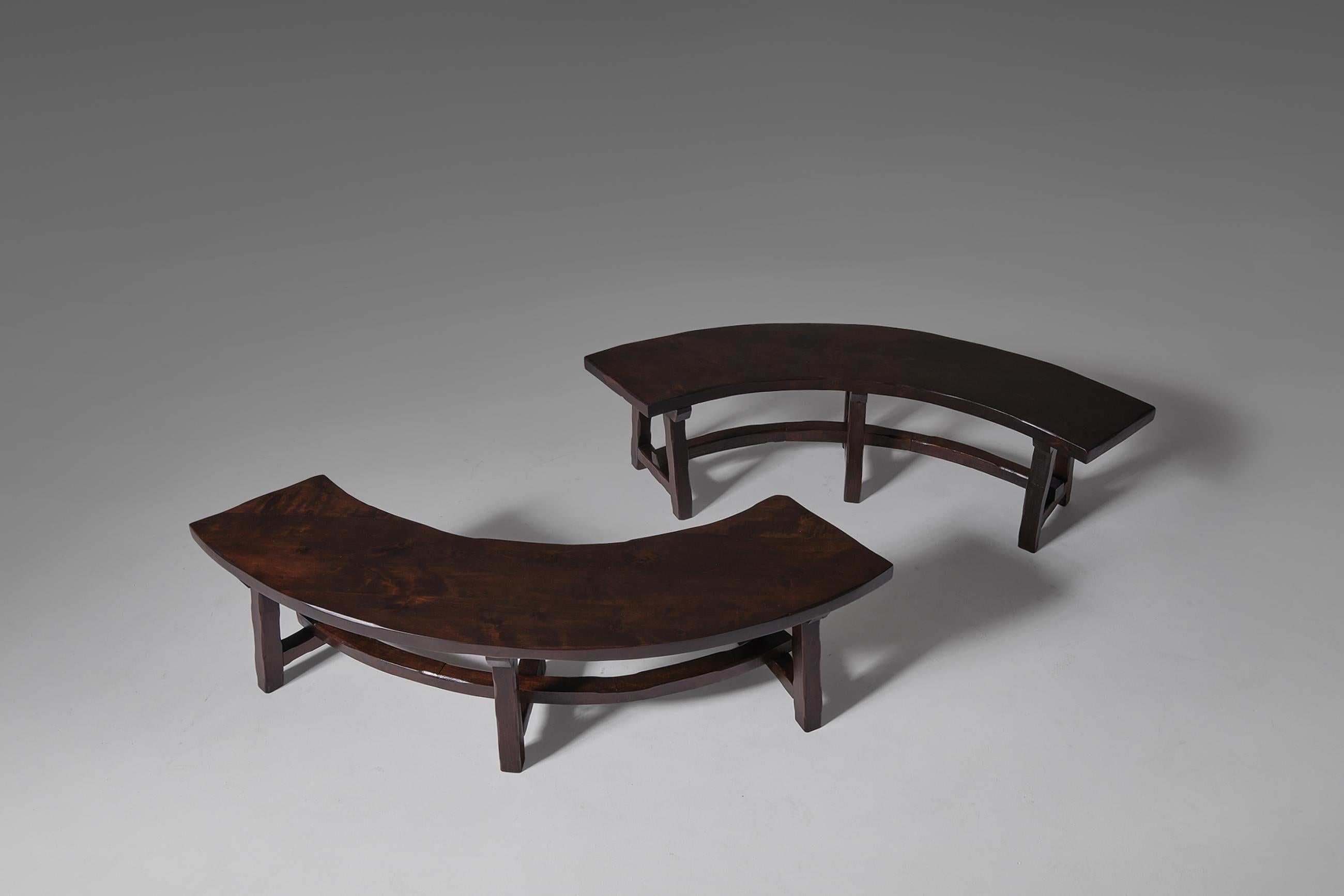 Primitive stained ash wooden benches, France 1970's. The set is constructed out of solid dark stained Ash wood with nice warm tones. Every single element is carved by hand, this causes a very nice artisan character. Every bench can accommodate 2