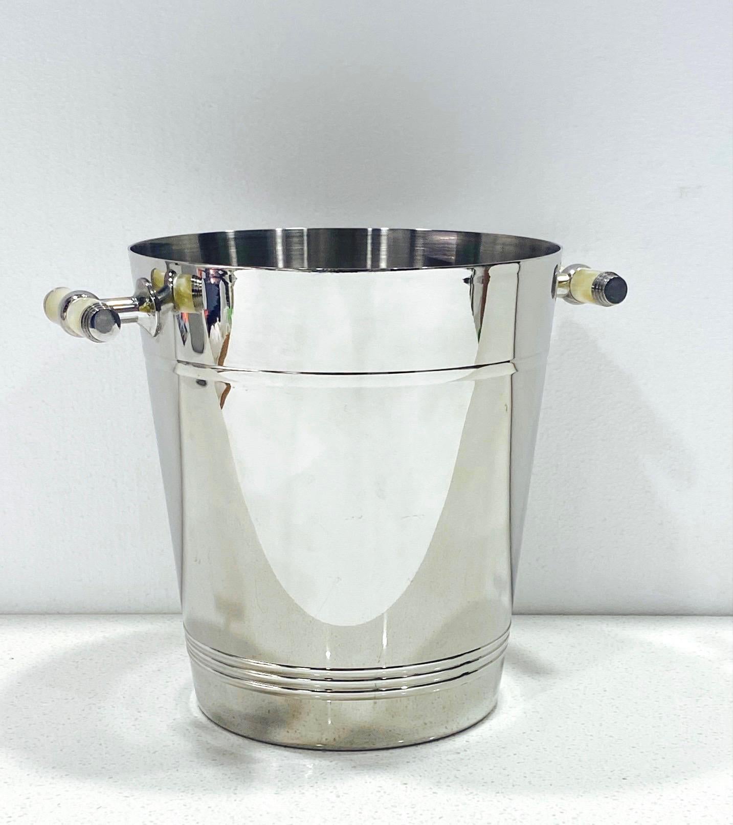 Vintage Art Deco style handmade stainless steel wine cooler, circa 2000. Can be used to chill bottles of wine, champagne, or as a large ice bucket. The cooler has a polished exterior with a nickel finish and features stylized handles in pearlescent