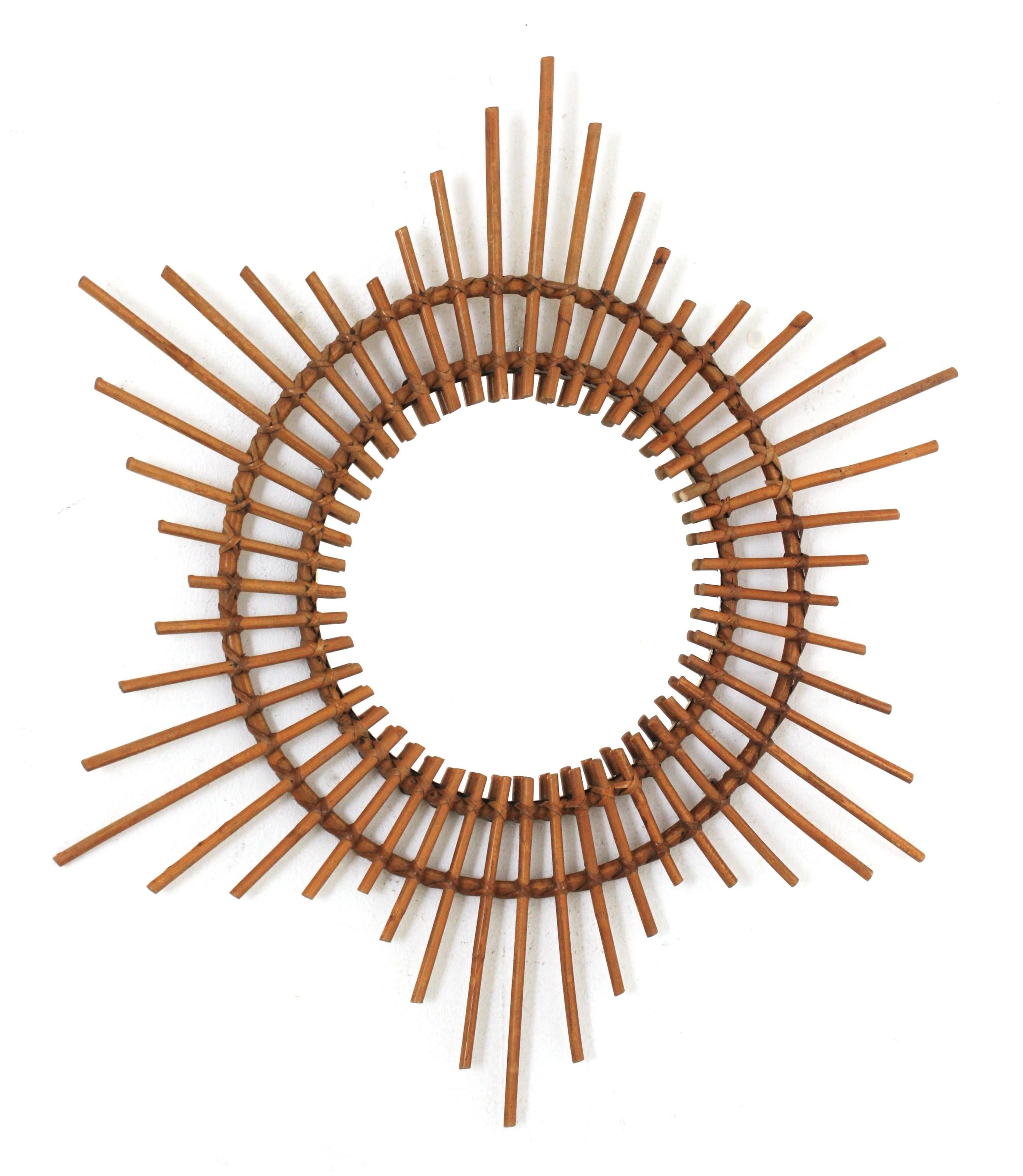 Rattan Sunburst / Starburst Mirror
A beautiful handcrafted rattan starburst mirror. France, 1960s.
This mirror can add all the freshness of the Mediterranean French Riviera style to any countryside/beach house decoration. It can be also interesting