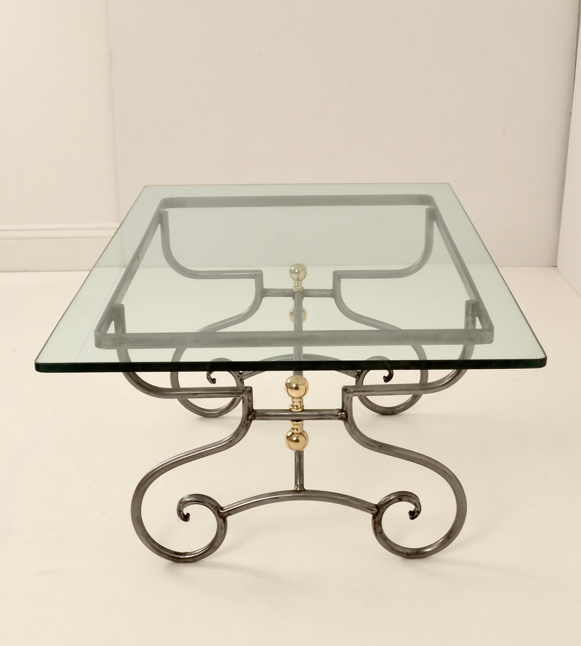 In a style reminiscent of a traditional French baker's rack, this steel and brass base has super quality. The base has been newly polished and lacquered. Heavy glass top is 1/2