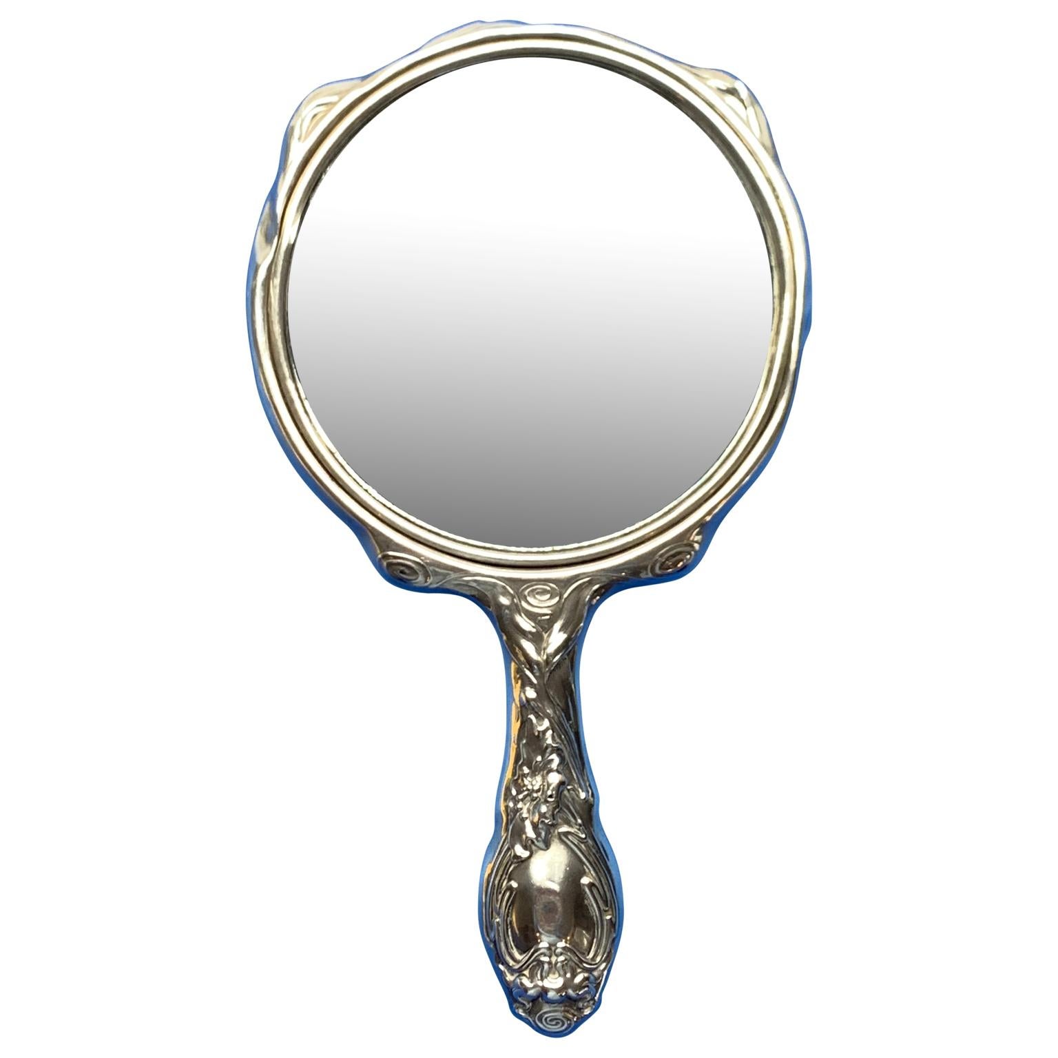 French sterling silver Art Nouveau hand vanity mirror

Mirror has beveled mirror-glass and marked for sterling silver.