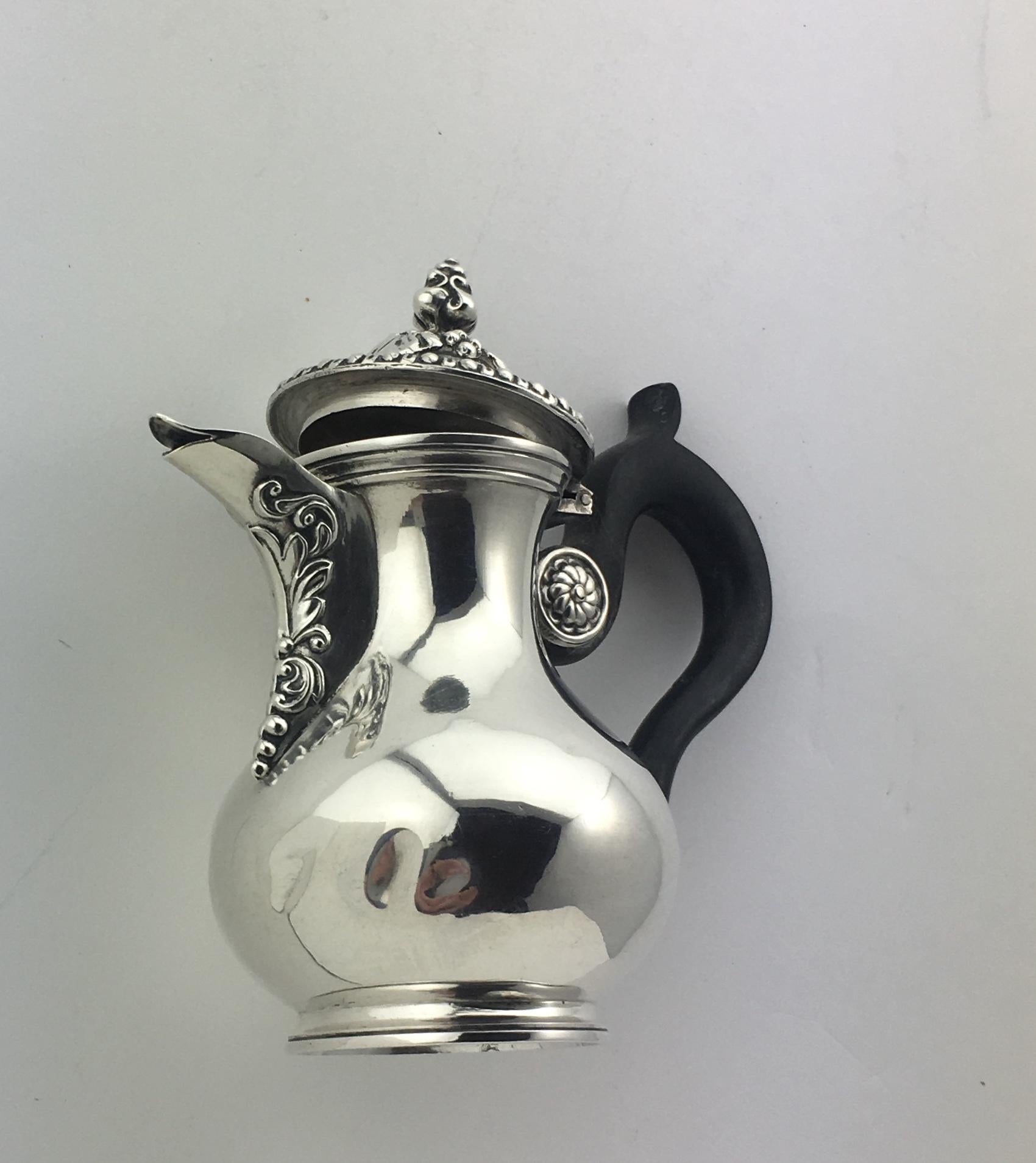 Gorgeous antique French sterling silver chocolate or cream pot with fluted body circa 1860. The prestigious silversmith that handcrafted this beautiful piece is Martial Fray listed as one of the most well known 