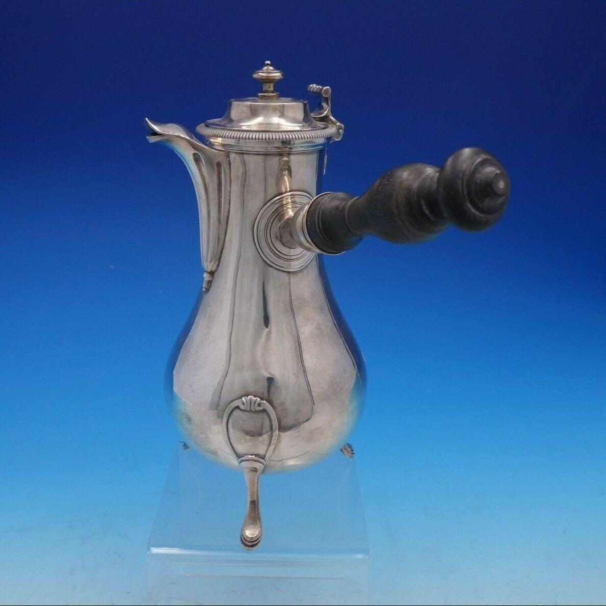French sterling 

French sterling coffee pot with wood handle, short spout, and 3 applied feet from Paris circa 1781-1789. It measures 10 1/2