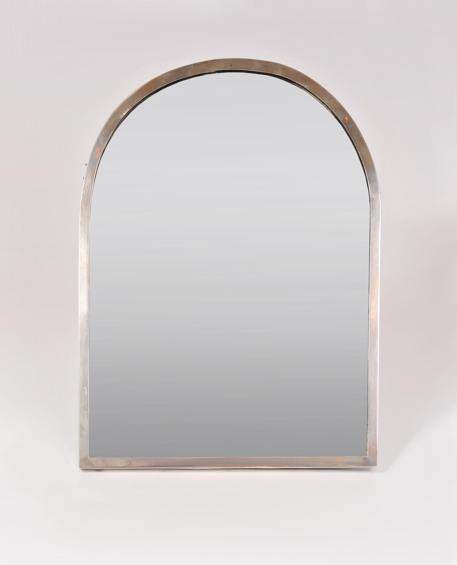 Arch mirror with sterling silver frame and shaped back strut, signed G Keller, Paris.
