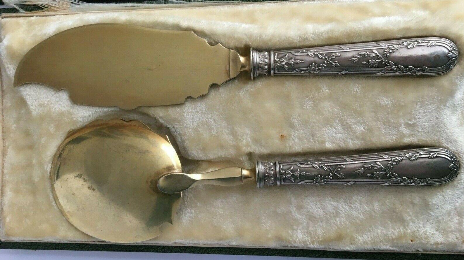 French Sterling Silver Ice Cream Dessert Servers in their Original Box

Complete two piece service, comprising of a large serving spoon and knife or slice, finely housed in the original presentation box.
The blades are beautifully embellished with