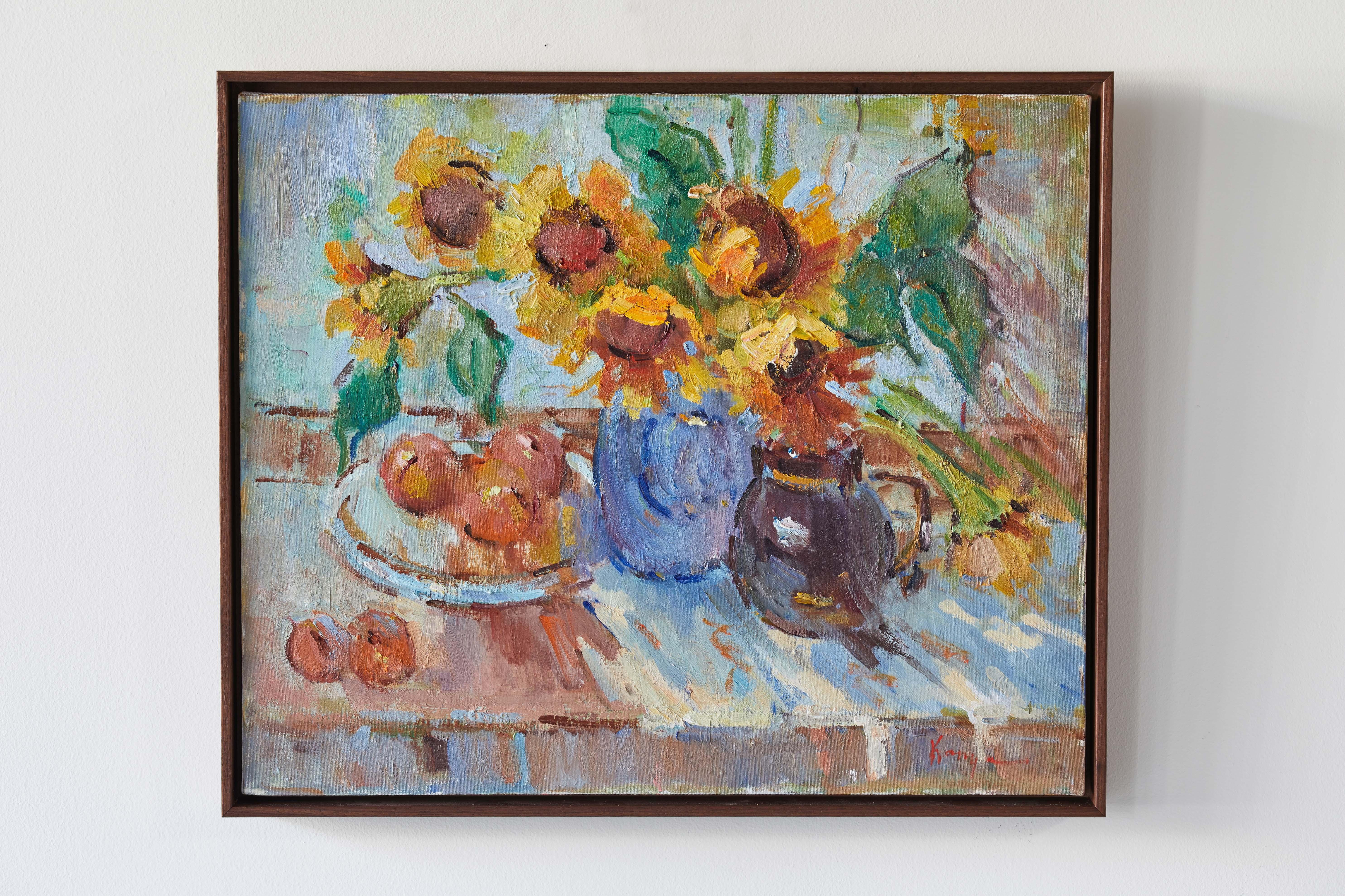 French still life painting of sunflowers and fruit with warm hues of yellows, oranges, and blues.
