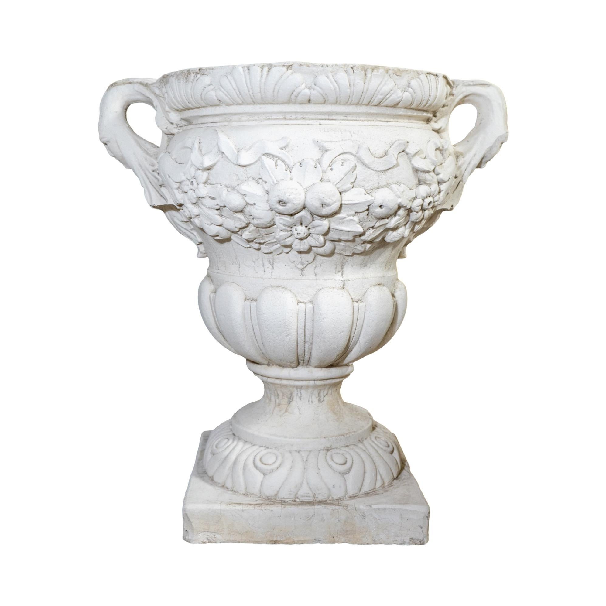 This elegant French-carved urn is an exquisite piece of craftsmanship. Made from a cement composite and with a white wash finish, this urn is the perfect addition to your home or garden space. Transform your garden space with a timeless mid-century