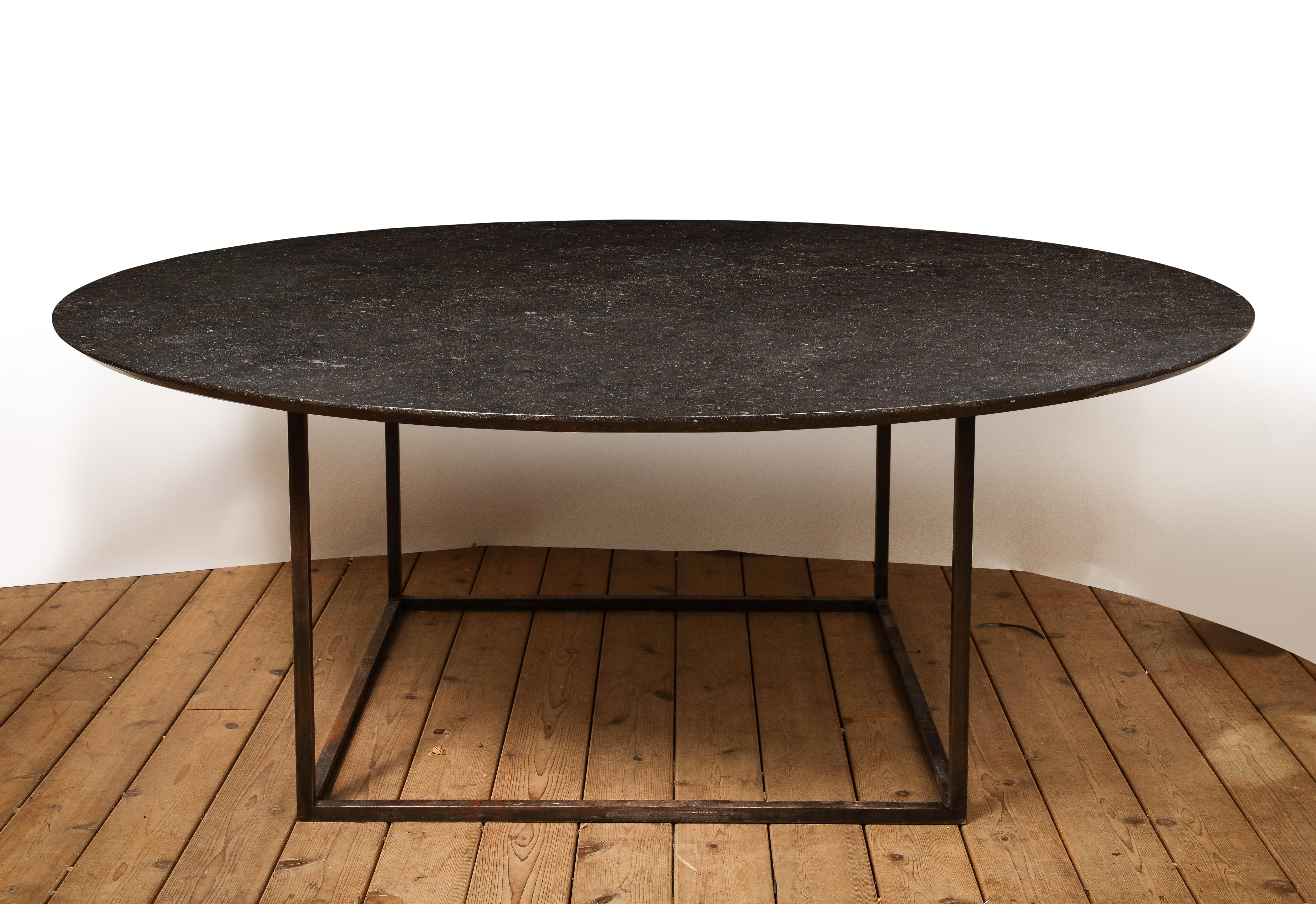 20th century French dining table with black stone round top on a custom square steel base. Clean, simple lines and large scale. 