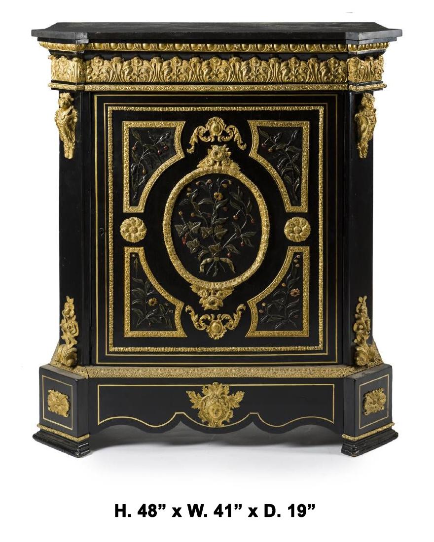Impressive 19th century French Napoleon III stone overlay ormolu mounted ebonized cabinet with black marble top.

The shaped black marble top is over a gilt bronze mounted frieze in an leaf-tip motif with an egg and dart border, above a large