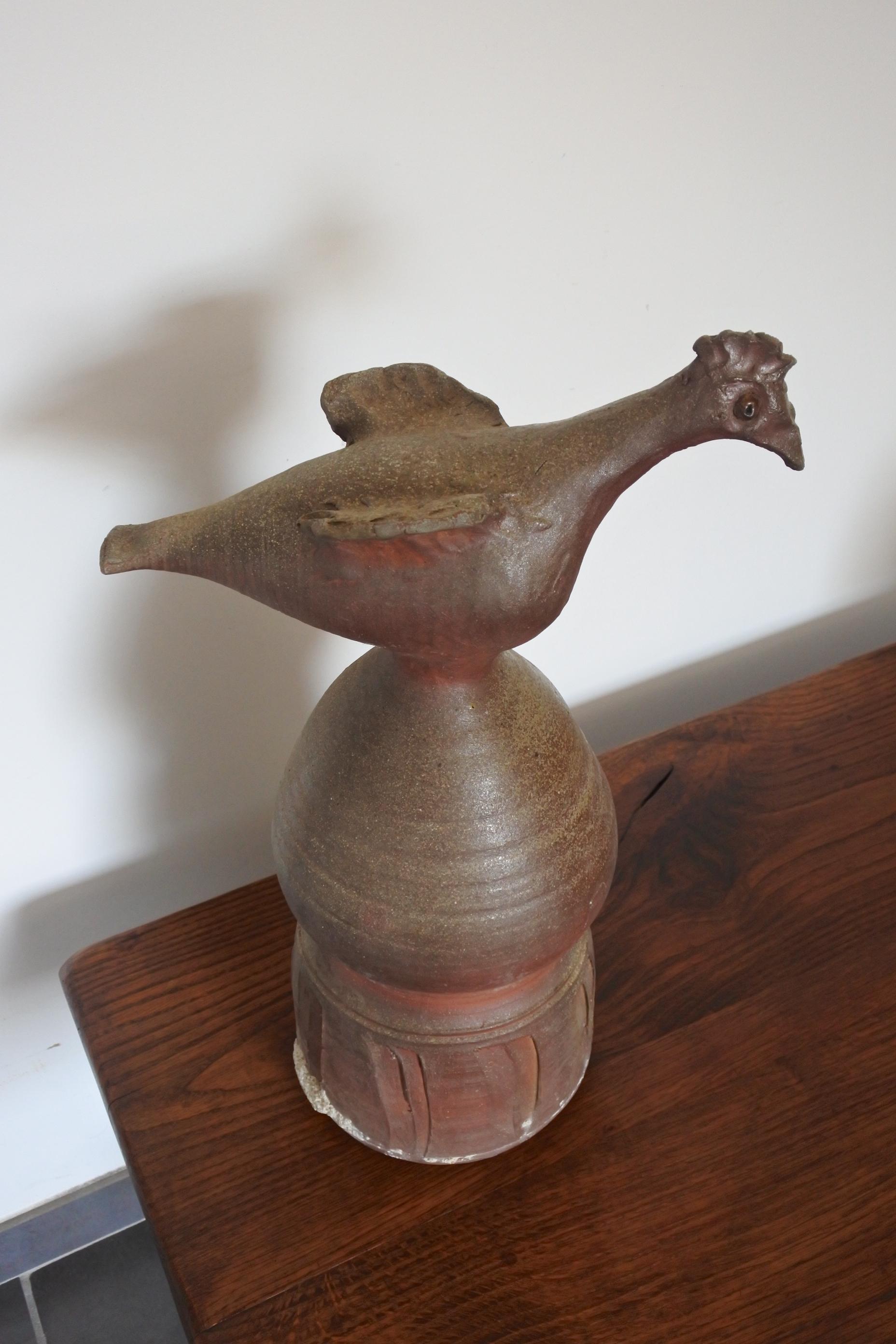 Stoneware roof finial by French pottery artist Jean Michel Doix.
Sculpted bird on a stand.
Made in the region of La Puisaye, renowned pottery centre in France.
The finial was recently taken down the roof it stood on for close to 45