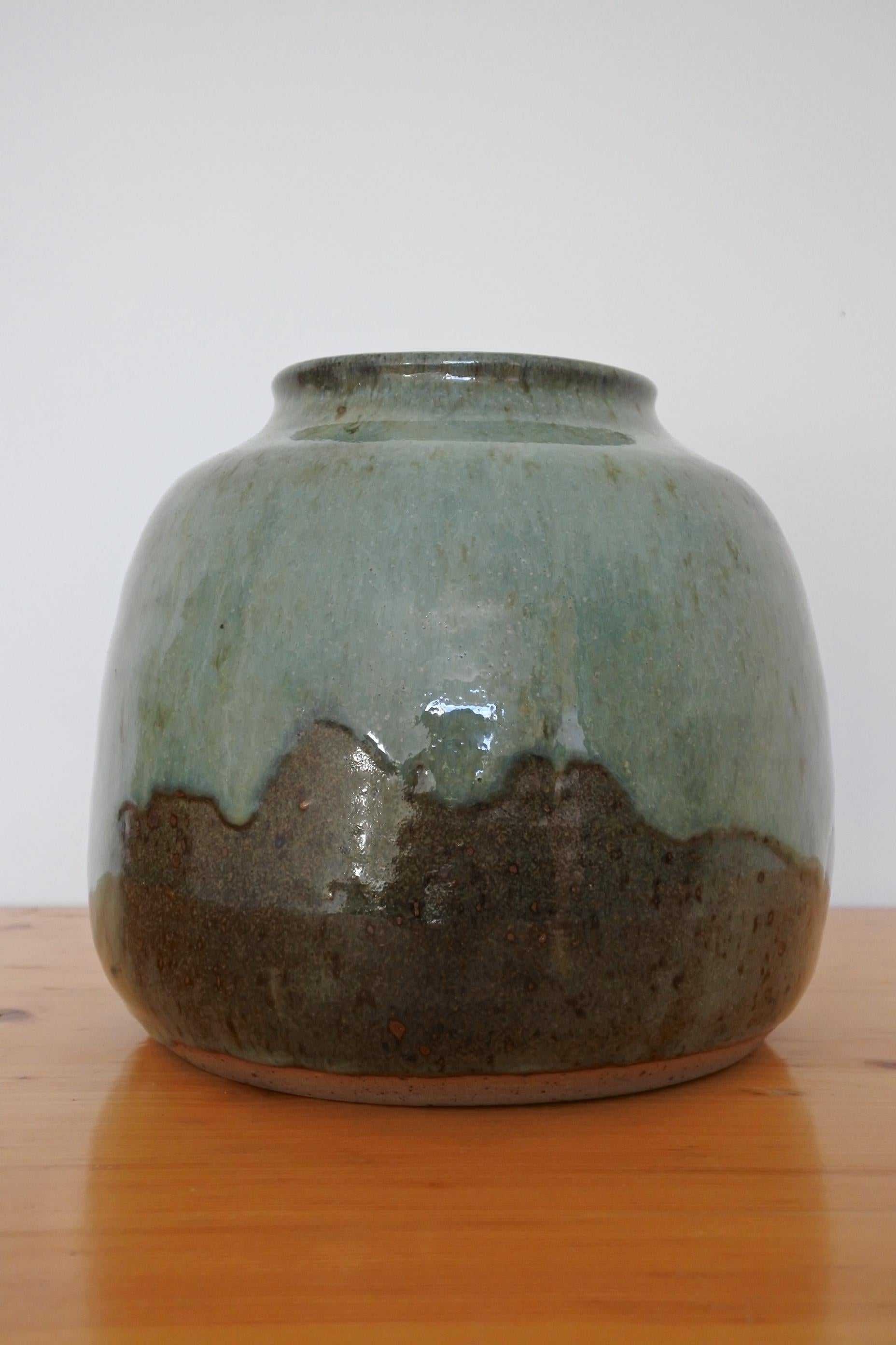 Stoneware vase from renowned pottery center La Borne in France.
1970s.
Outstanding dripping glaze.
Signed.
 