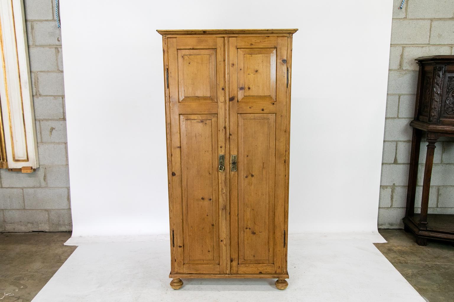 This French storage cupboard has two raised panels on each door with a shaped wooden astragal on the right hand door. The interior is fitted with twenty-seven drawers with the original steel bin pulls. The left hand door has the original steel