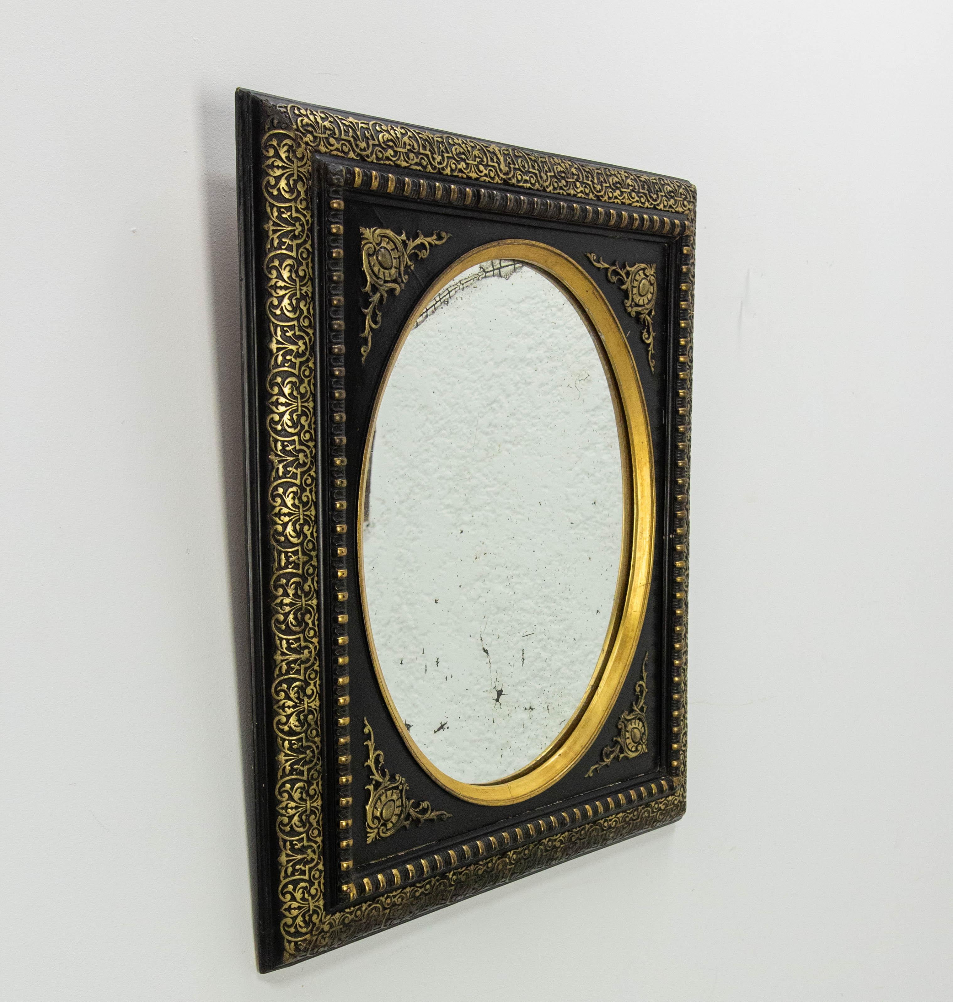 Napoléon III wood and stucco wall mirror painted of black and gold.
During the Napoleon III period, artists had a keen interest in everything to do with Eastern art. This explains the motifs on this mirror, created to invite travel.
The black and