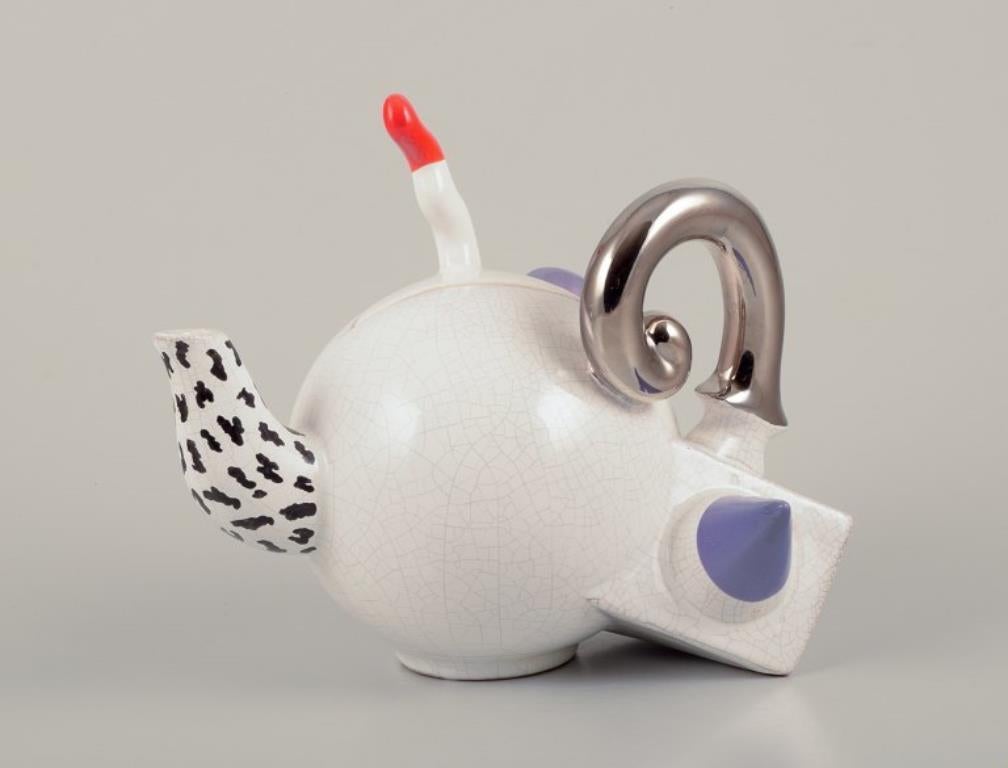 French studio ceramicist.
Teapot.
Abstract futuristic style.
Late 20th century.
Marked.
Perfect condition with natural crazing.
Dimensions: W 22.0 cm x H 20.0 cm.