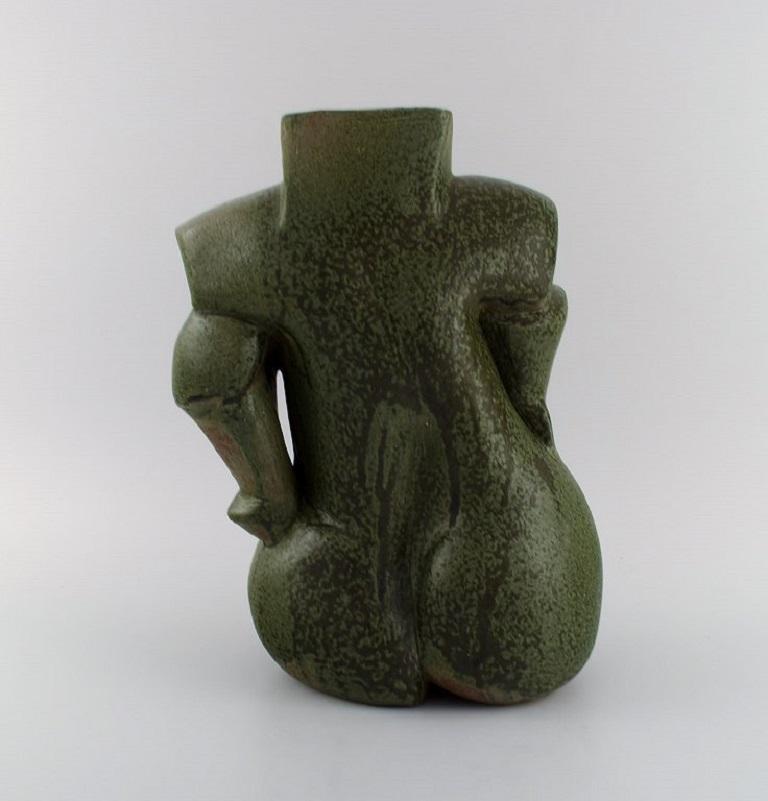French studio potter. Organically shaped unique vase in glazed stoneware.
Beautiful glaze in dark green shades. 
Sculptural design, 1980s.
Measures: 31 x 24 cm.
In excellent condition.
Signed.
