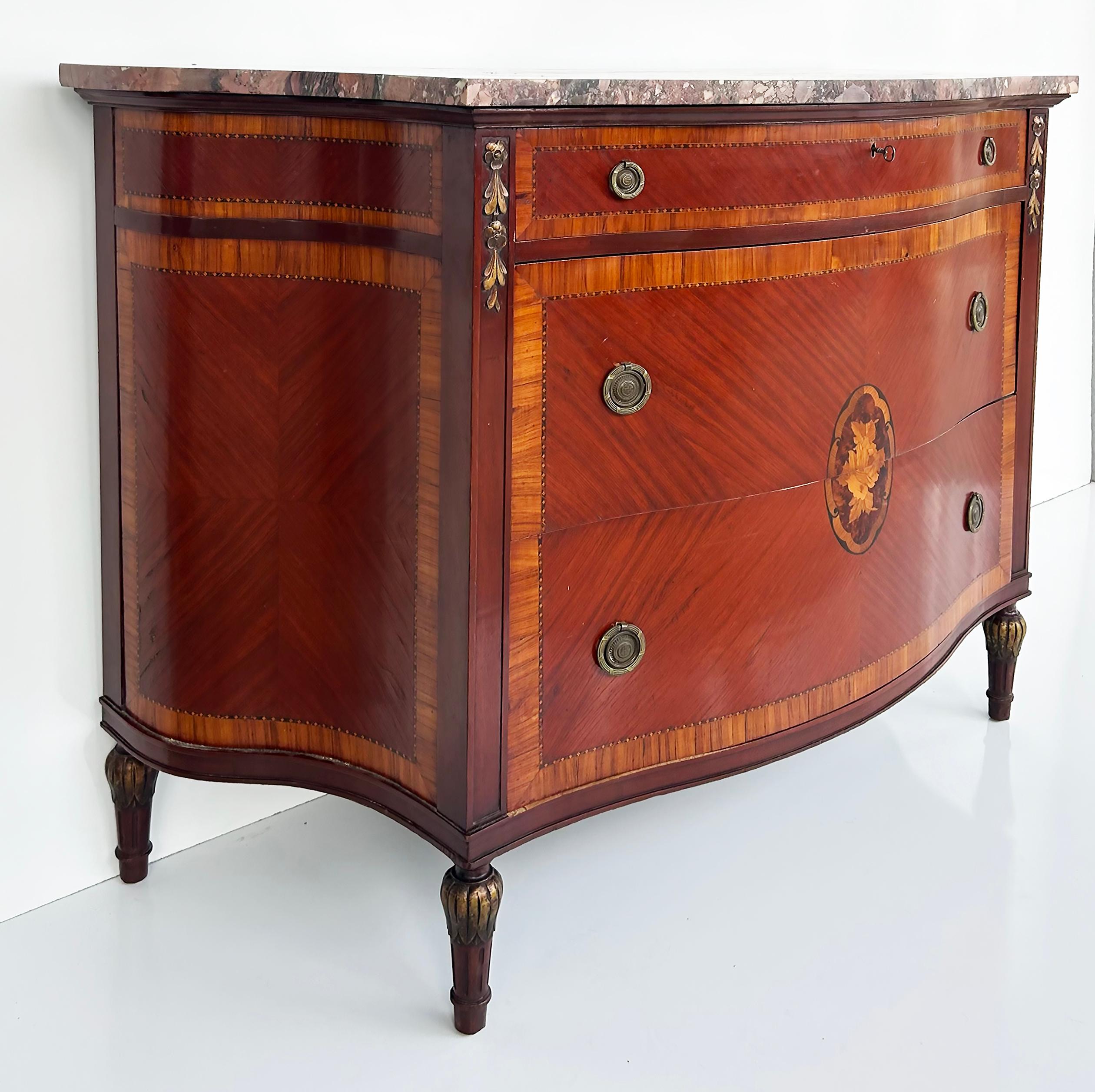 French Style 3-Drawer Chest of Drawers with Marble Top, Bronze and Marquetry

Offered for sale is a recent acquisition from a South Florida estate.  This French-style three-drawer marble top chest of drawers has wonderful marquetry with three