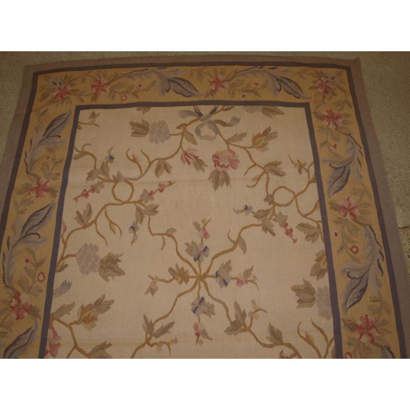 A small size Aubusson in the 19th century French style.

About 10 years old.

This small Aubusson is in the style of 19th century France, the ivory ground has a lattice with floral designs, The overall colour pallet is very soft and pastel. The
