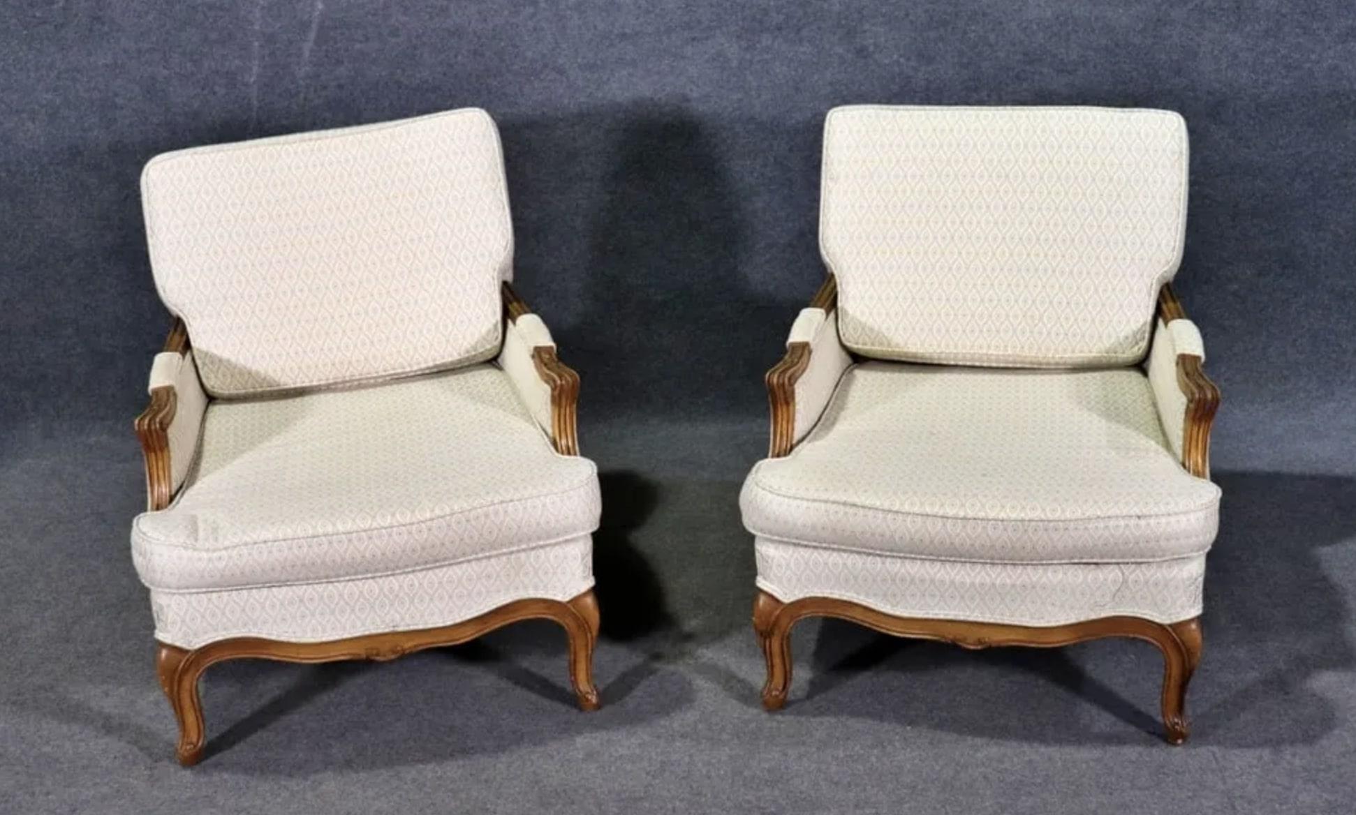 French style armchairs with deep seats and sculpted walnut frames.
Please confirm location NY or NJ