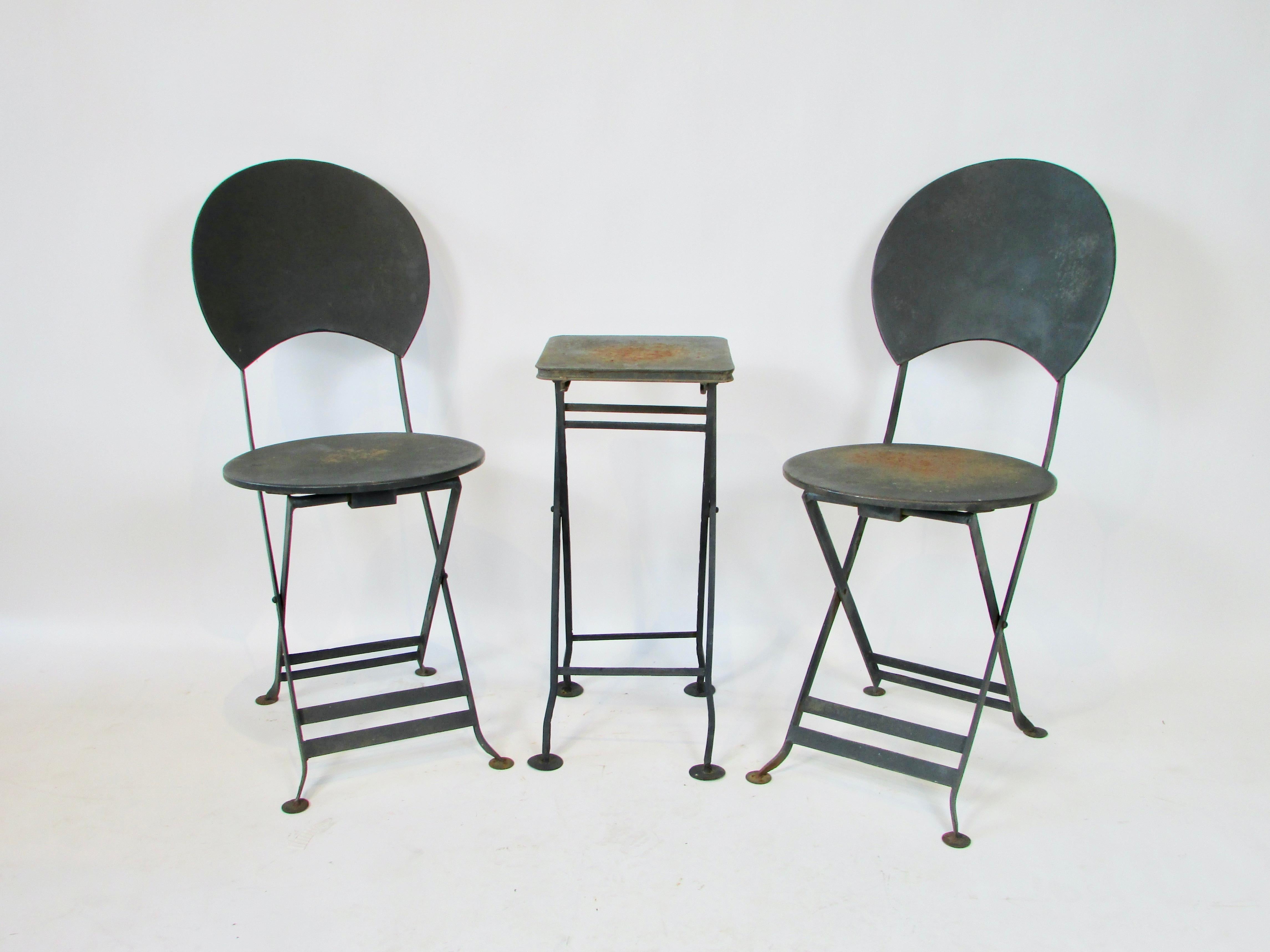 Two French style bistro chairs with compact table ( 10.5 x 11 at 24.5 tall ) . Welded steel frames support 15.25