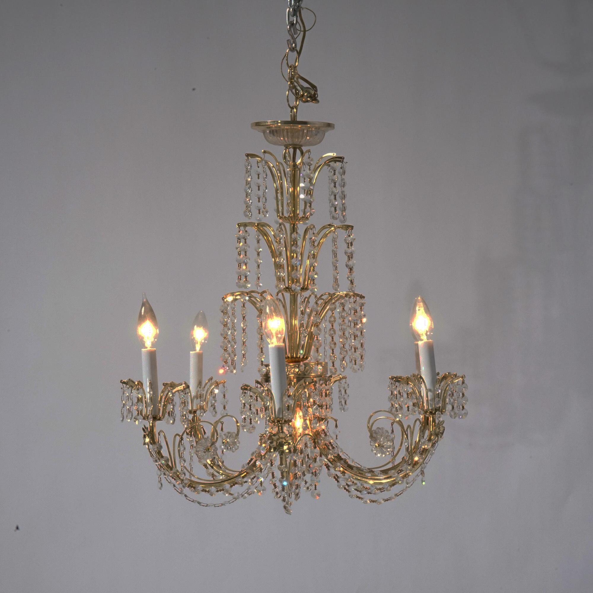 French Style Brass & Crystal Tiered Prism Chandelier with Scroll for Arms Terminating in Candle Lights and Strung Crystals Throughout, 20th C

Measures - 23