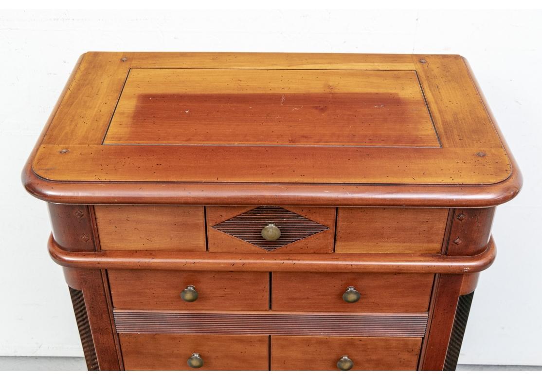 Grange quality Chest in French Style with Cherry Stain in a useful size. The top with rounded front corners and dowel construction. One small center diamond ribbed drawer at the top over five long drawers, carved and looking like two each with