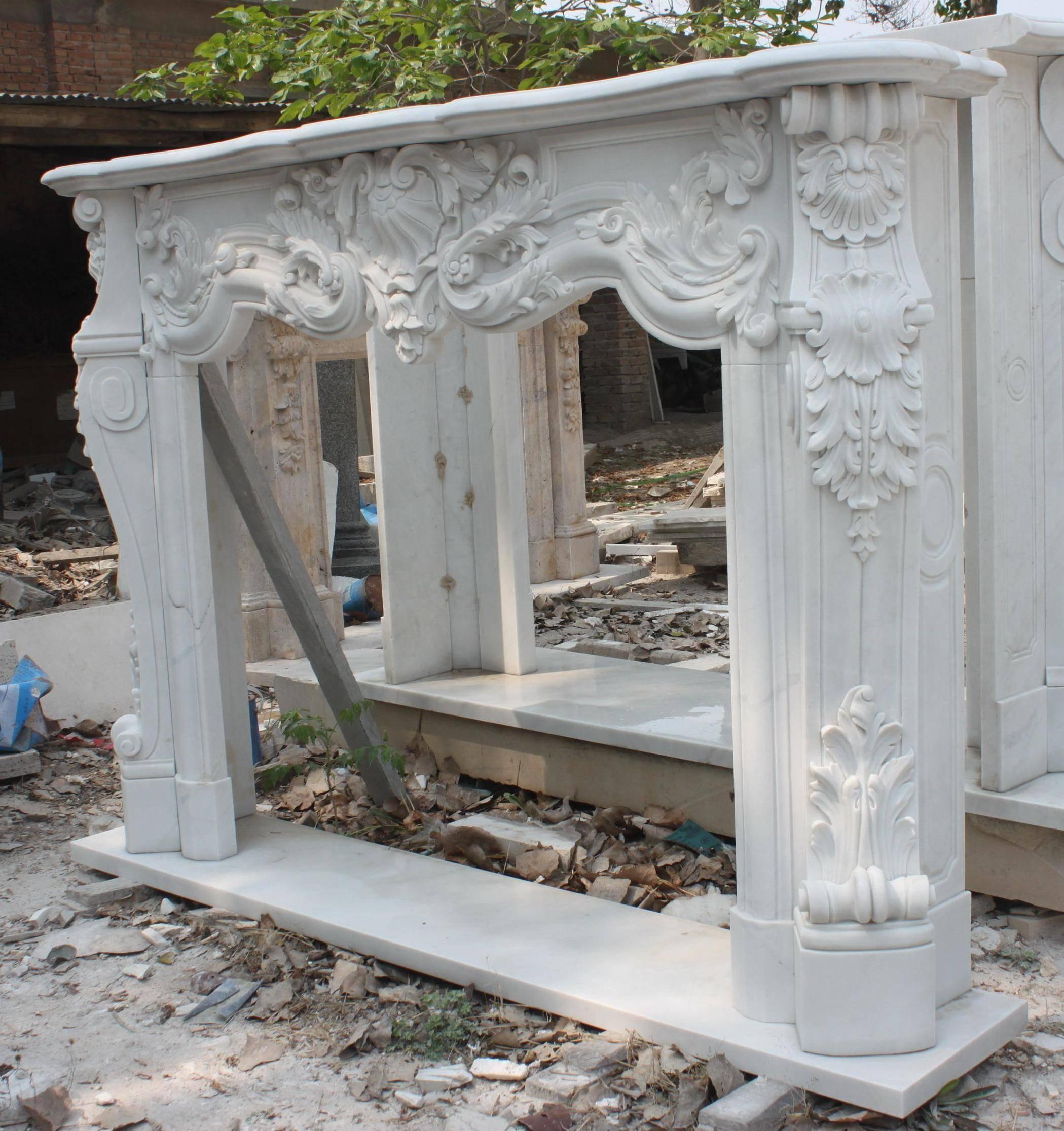 Measures: Width 190 cm 74 3/4 in
Depth 35 cm 13 3/4 in
Height 136 cm 53 1/2 in

Composition 
Carved white marble

Antique French style

Heavy solid carved marble fire surround in an antique French style.
      